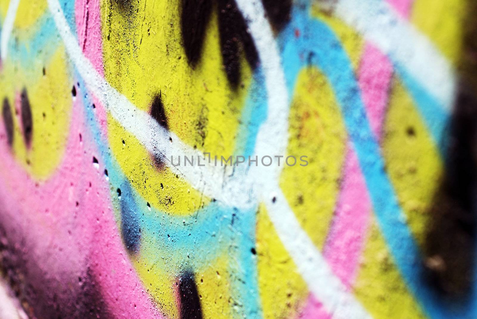A close up photograph of spray painted graffiti on a public wall
