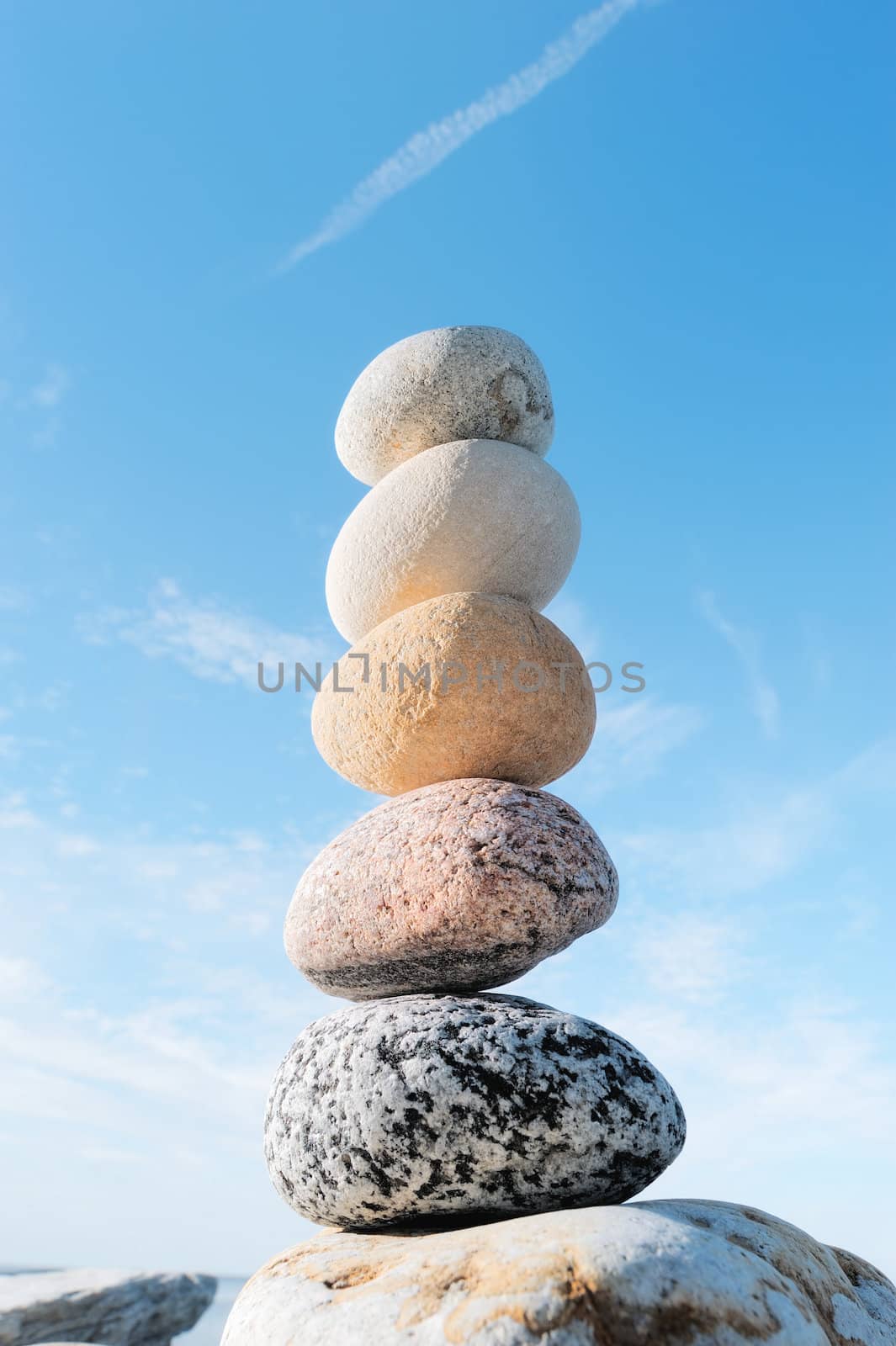Pile of round pebbles against the blue sky