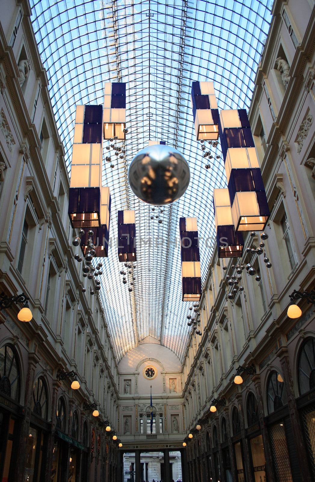 Ancient shopping galleria with modern details under glass roof in Brussels, Belgium