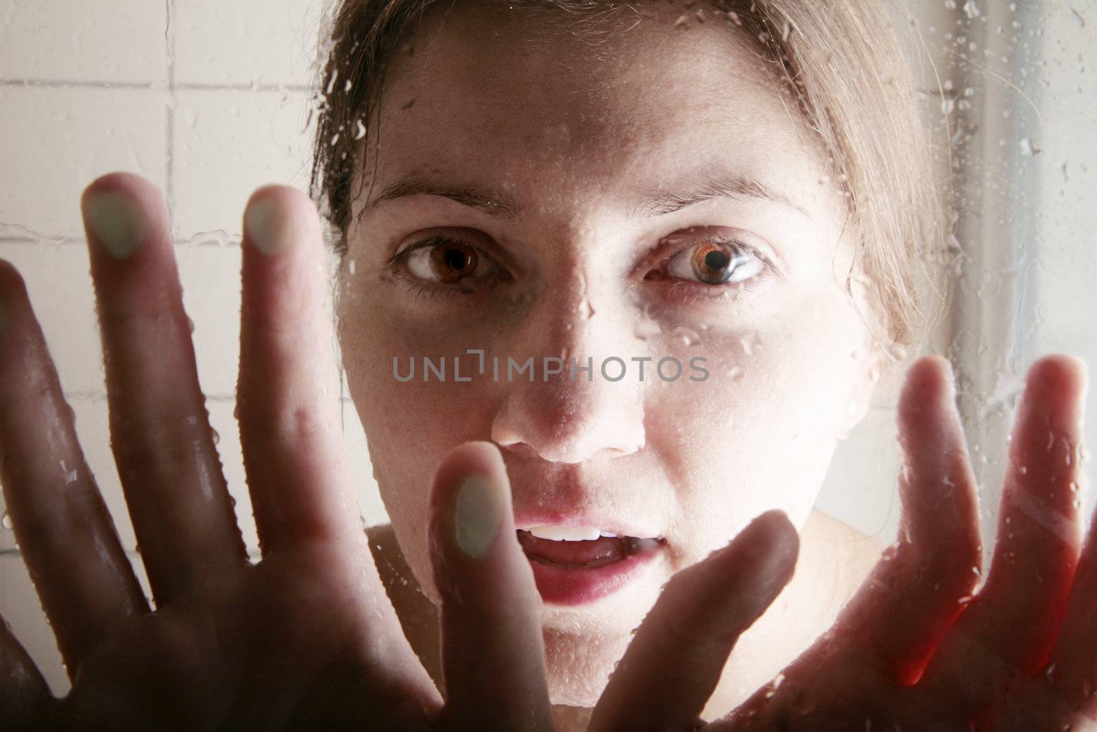 young woman trying to talk through the cabin shower