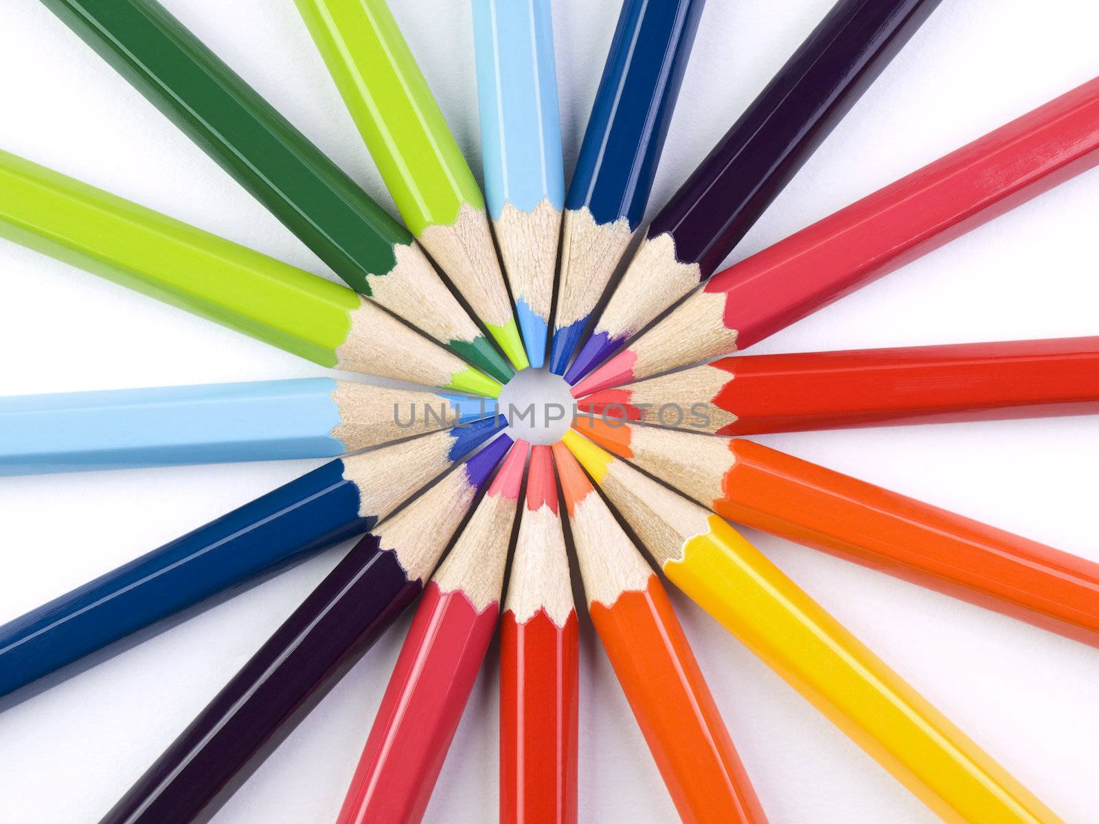 A circle formed by the points of several colored pencils.