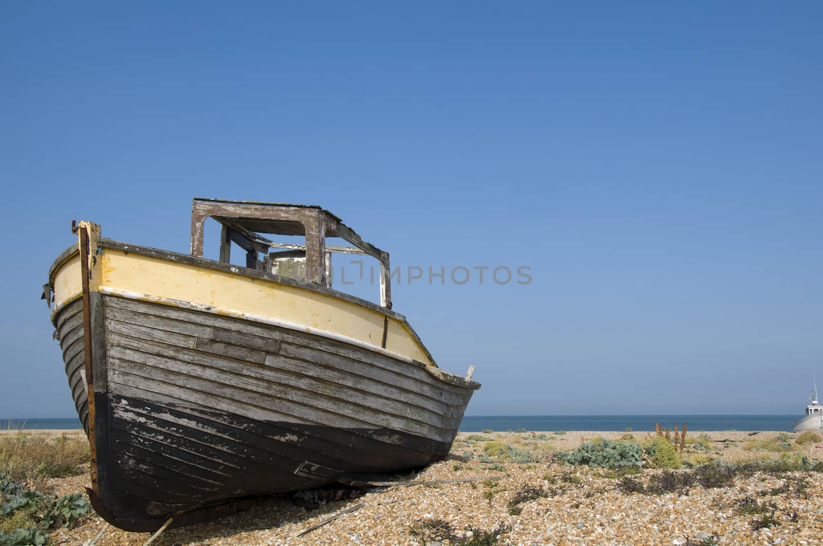 An old fishing boat on the beach at Dungeness