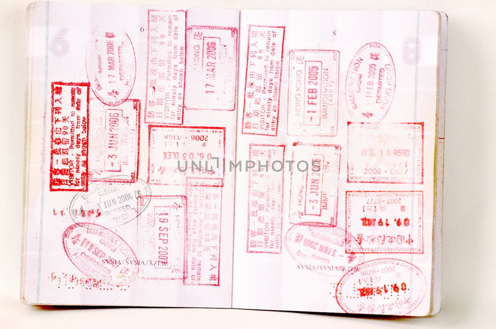European passport full of stamps from China and Hongkong borders.