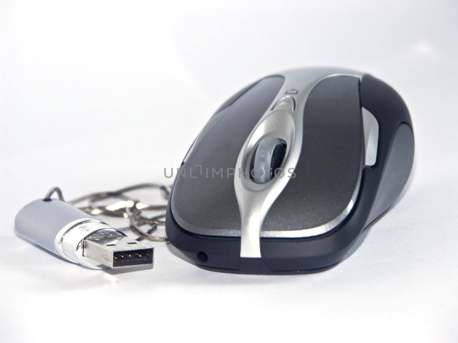 The image of the computer mouse and flash on a homogeneous background