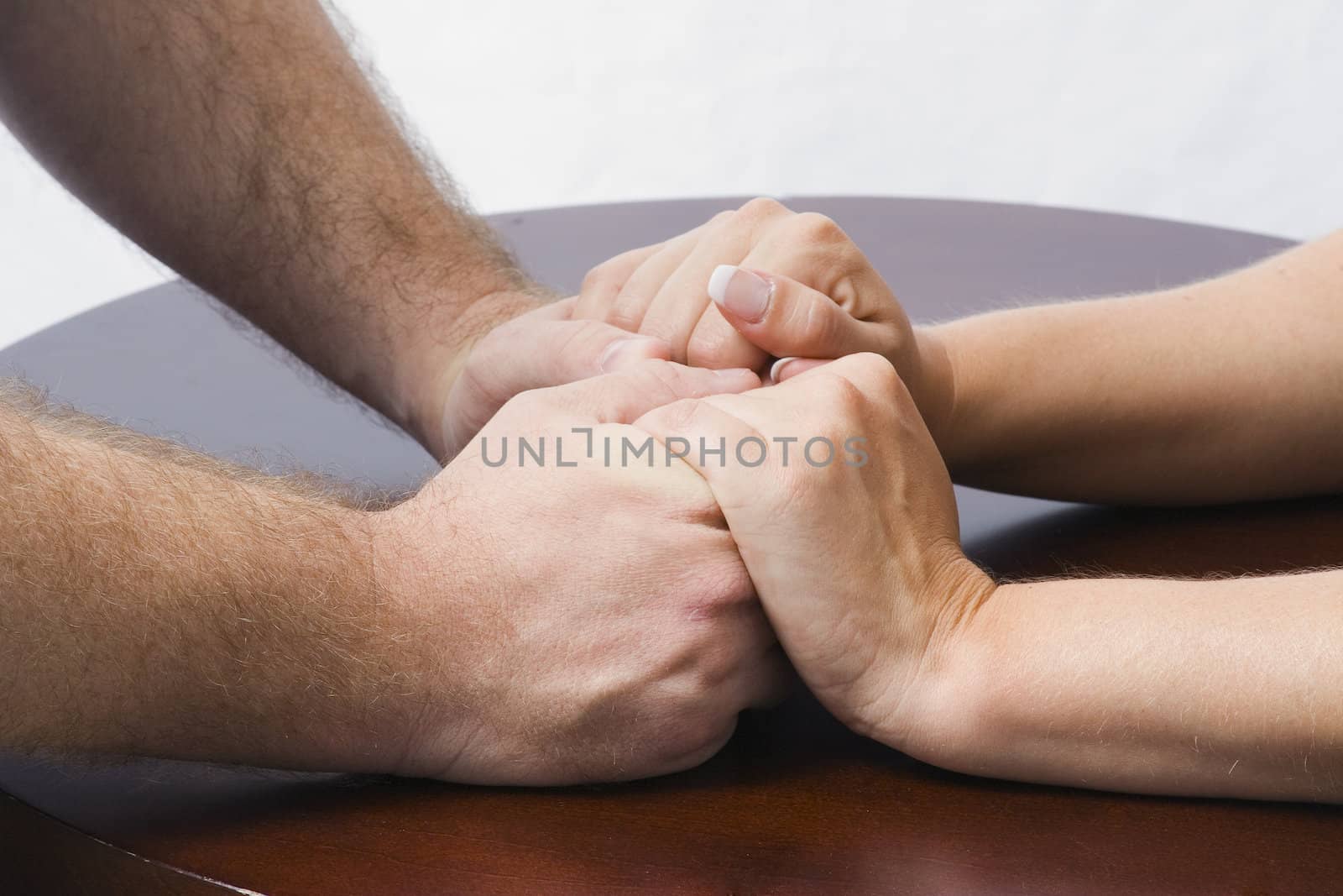 A couple holds hands, reconnecting to what the once had.