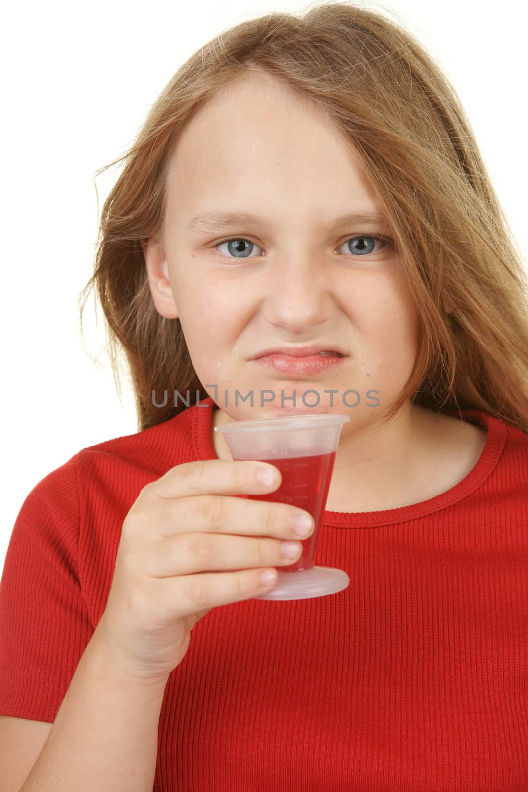 young girl taking medicine by clearviewstock