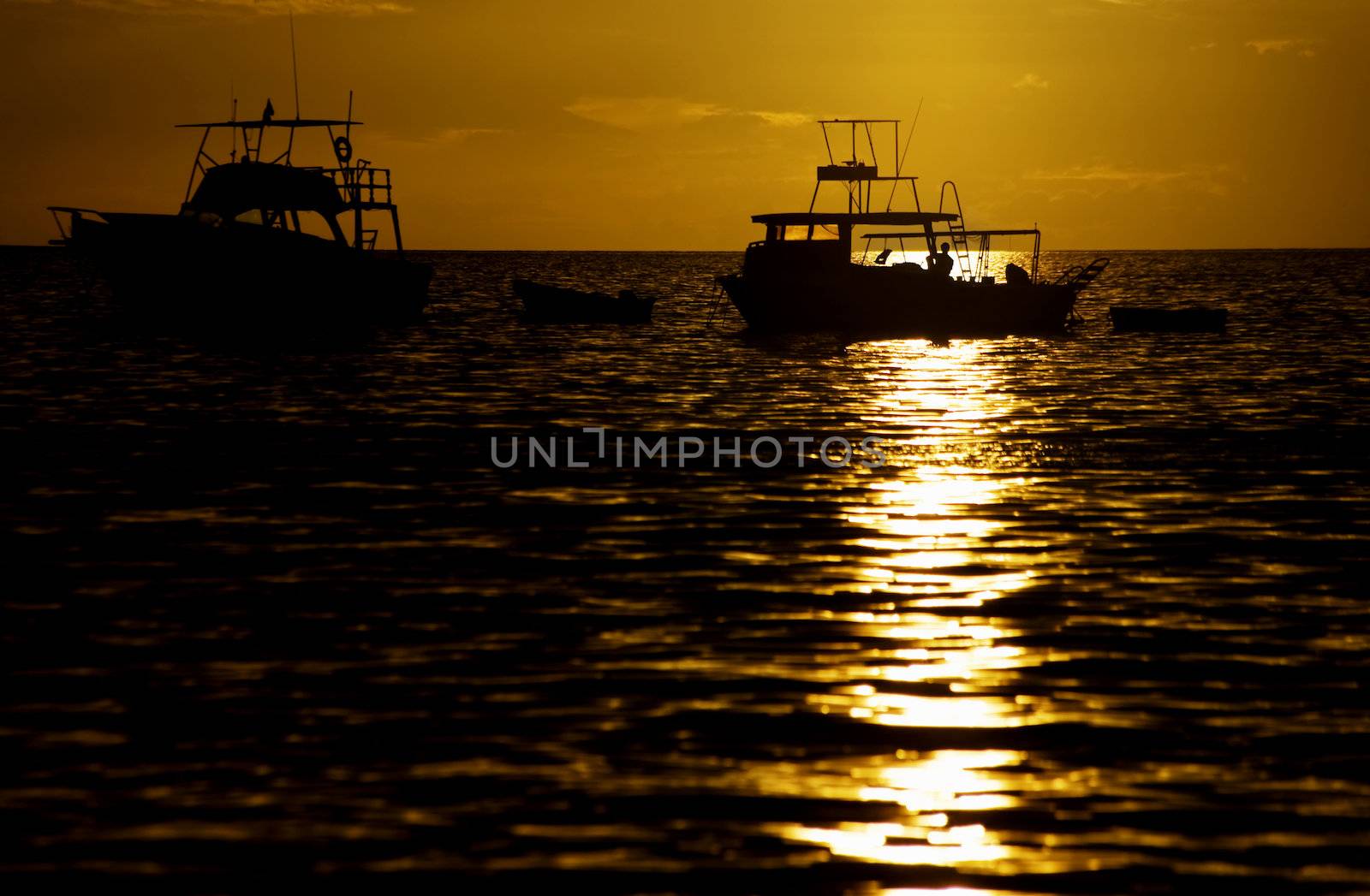 Costa Rica sunset with Boats in the Pacific Ocean