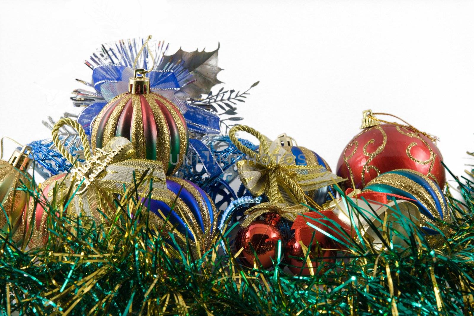 christmas spheres in a tinsel on a white background