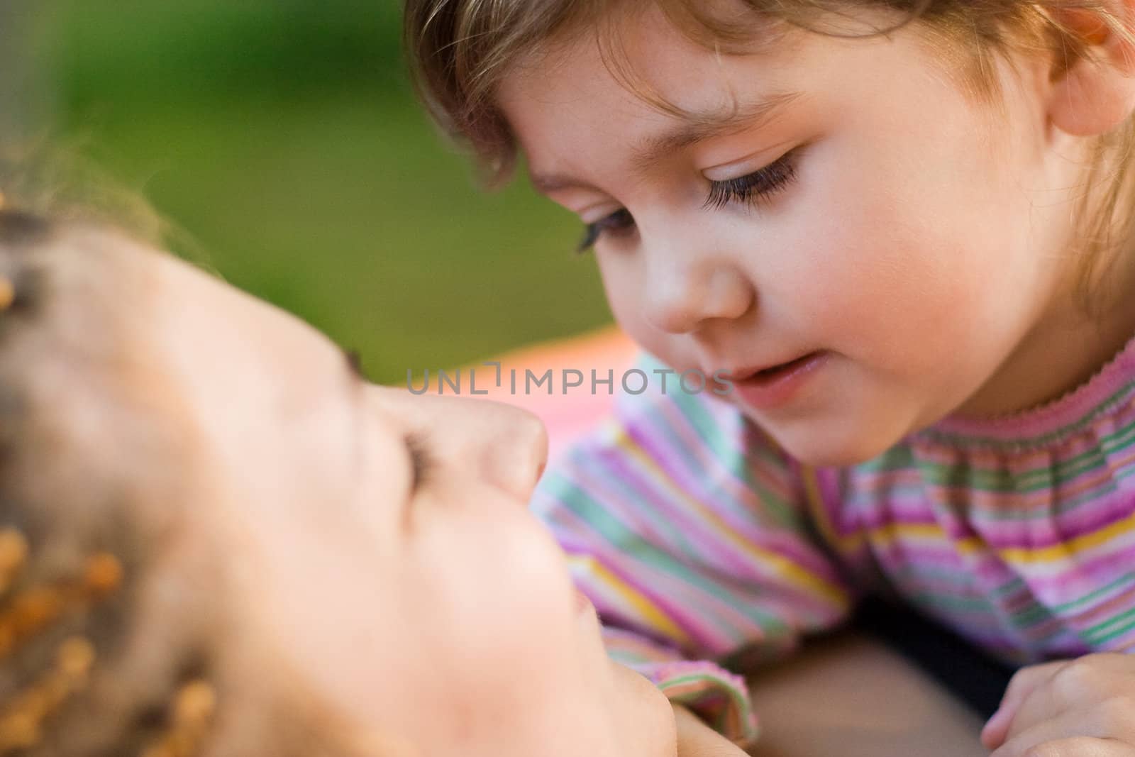 Mother and her daughter looking on each other