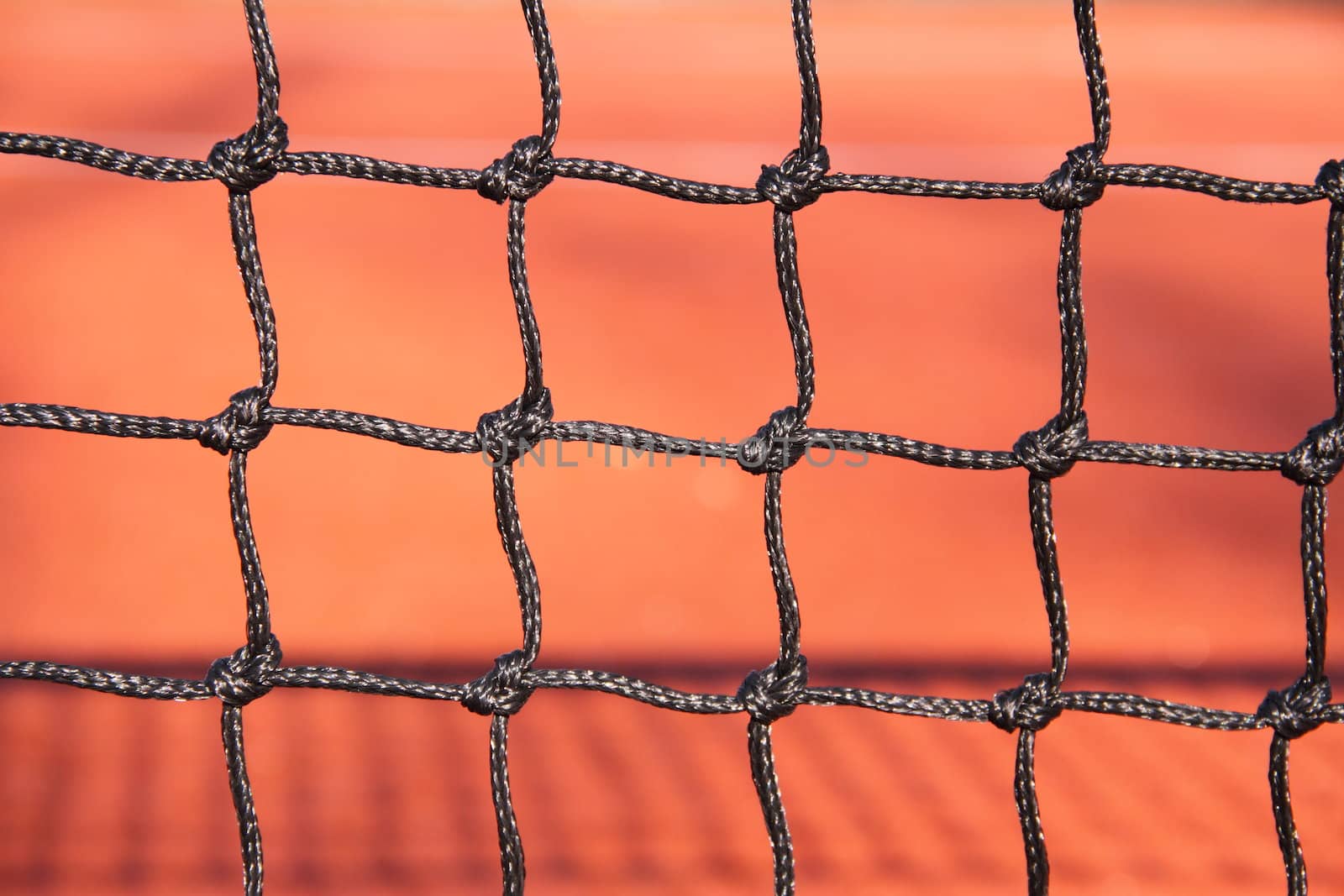 Very close view of the knots in a net.