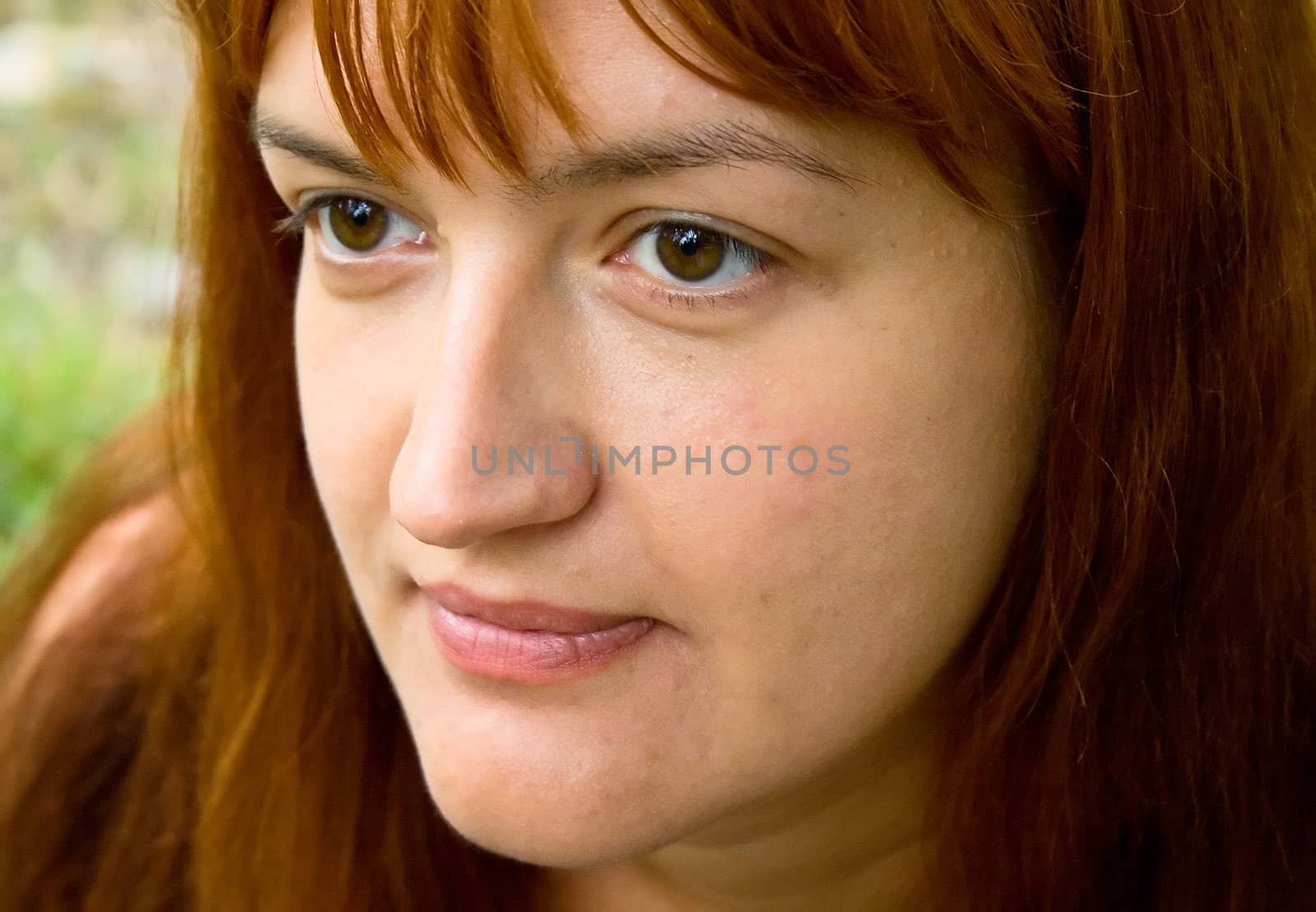 Portrait of the woman against green plants