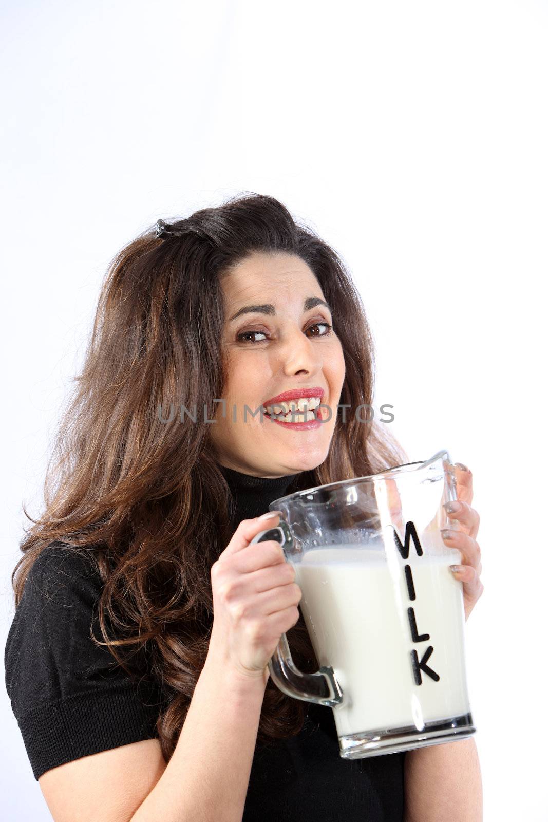 Health conscious young woman with milk - space for text