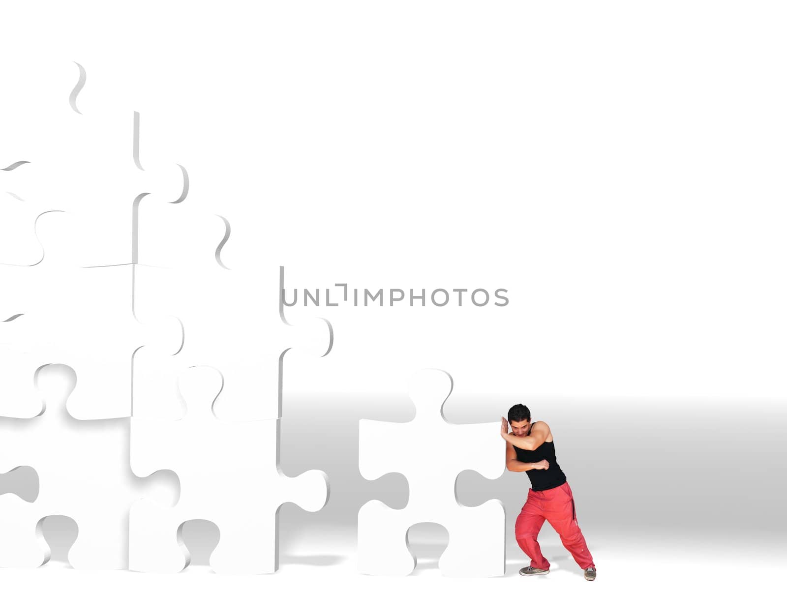 metaphor picture showing a guy moving puzzle pieces, applicable to several concepts