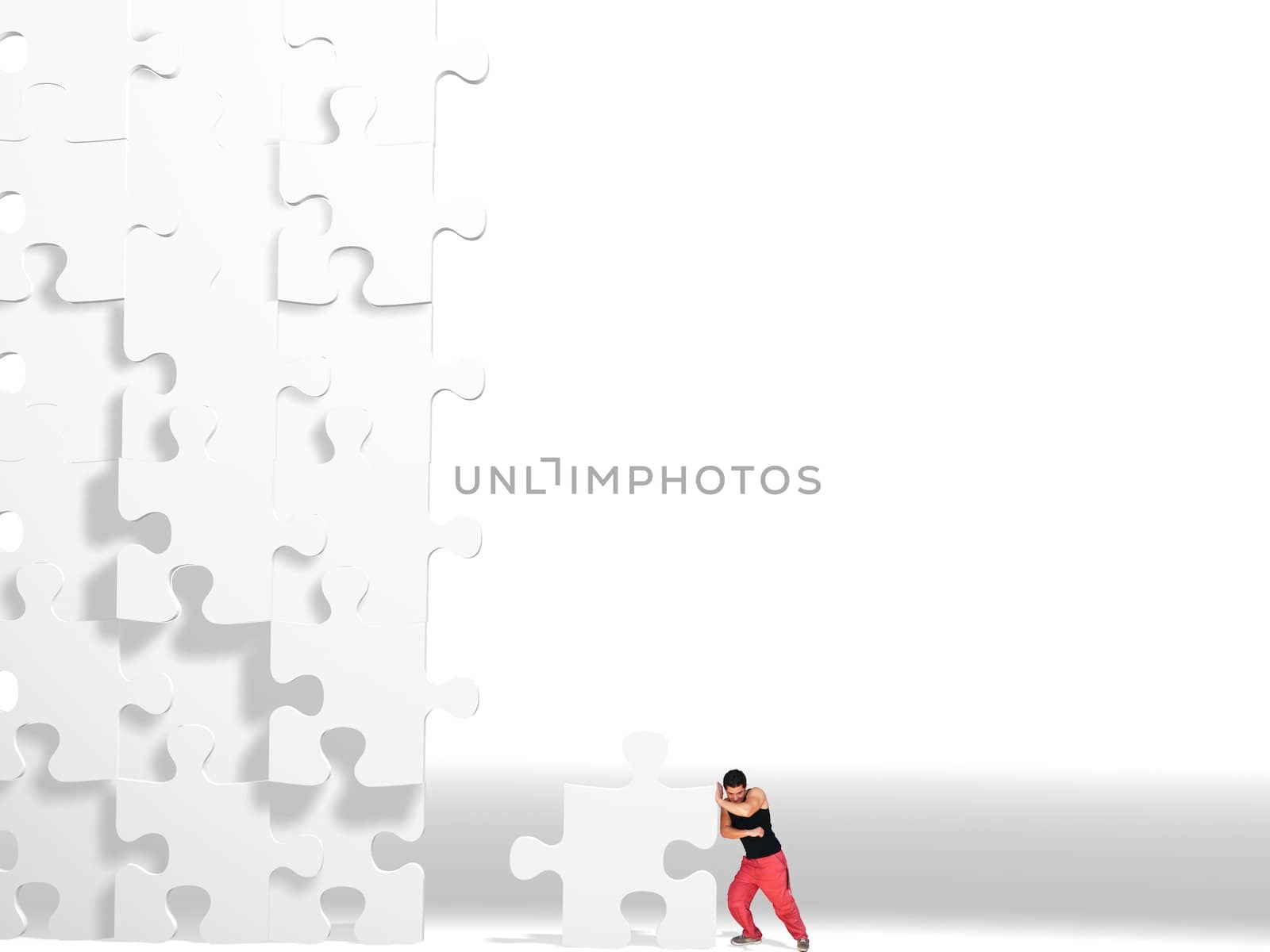 metaphor picture showing a guy moving puzzle pieces, applicable to several concepts