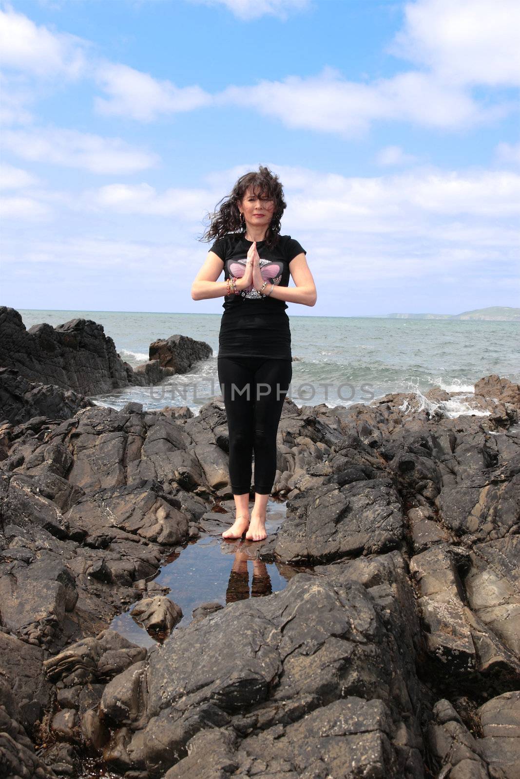 a beautiful woman doing yoga to show a healthy way to live a happy and relaxed lifestyle in a world full of stress