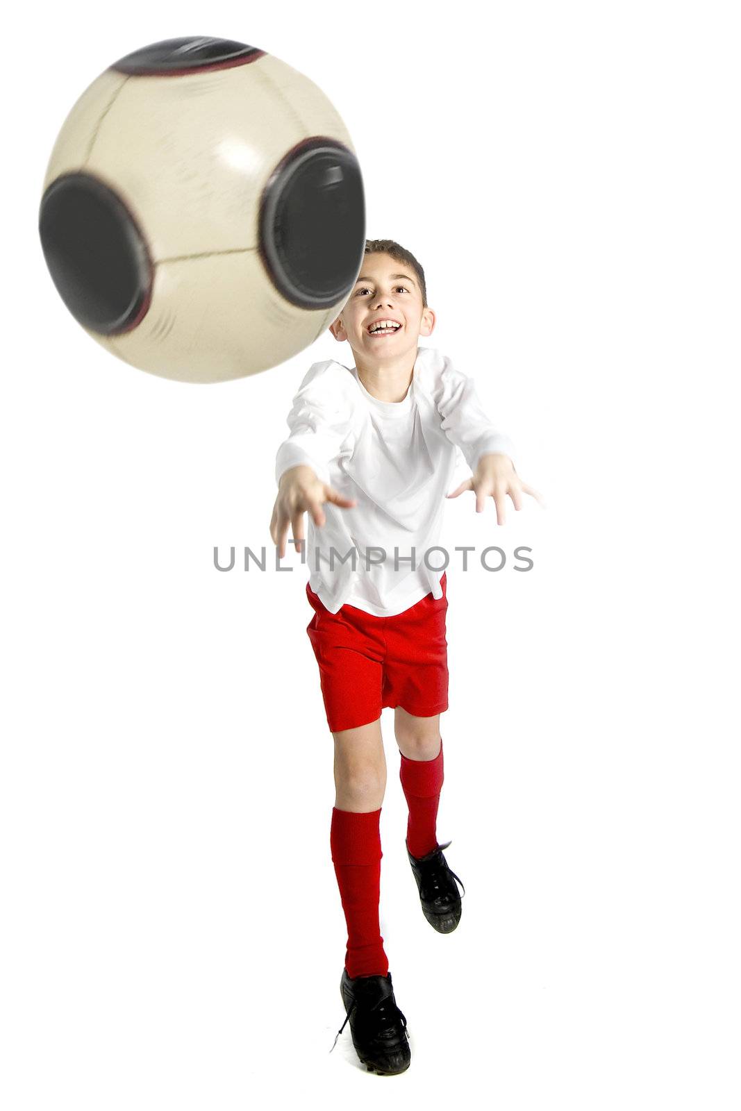 a boy in football uniform is throwing a football