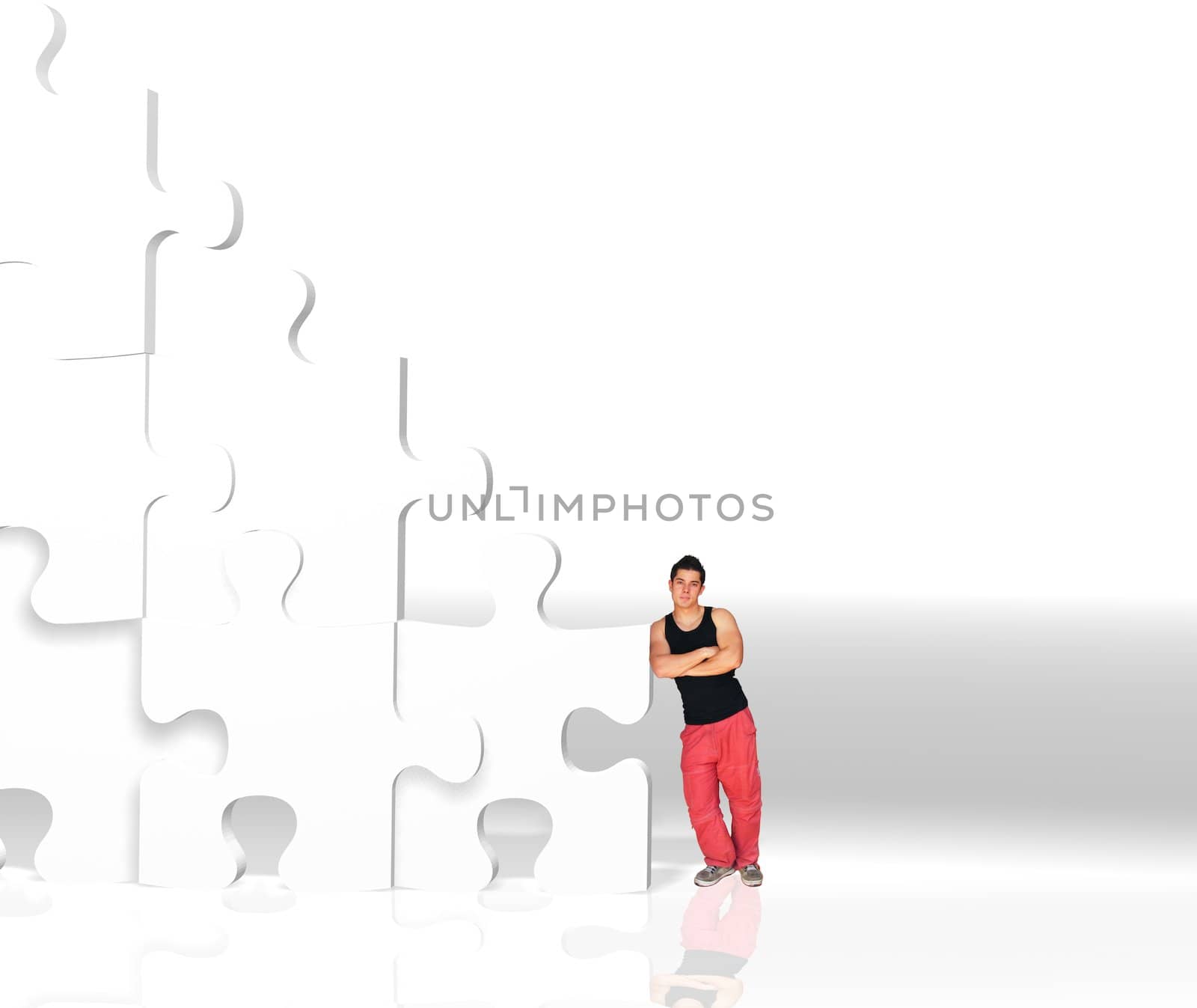 metaphor picture showing a guy moving puzzle pieces, applicable to several concepts