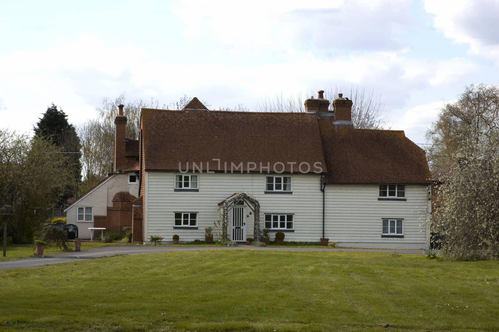 A large white house in the countryside