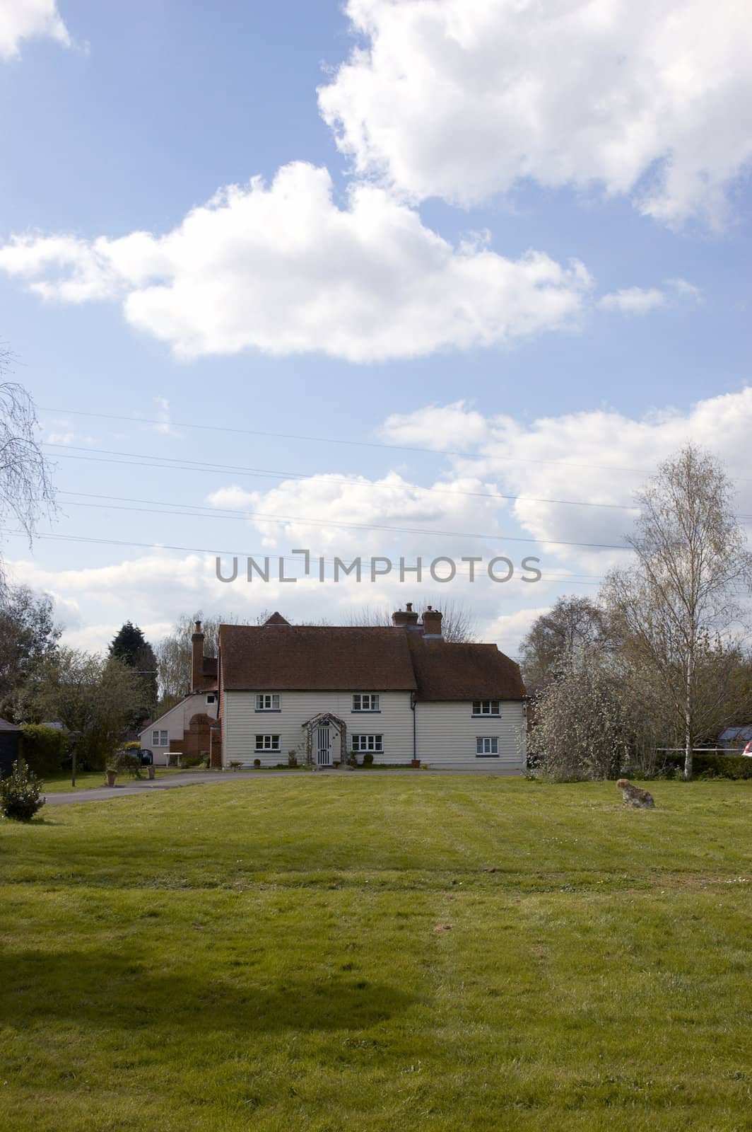 A large white house in the countryside