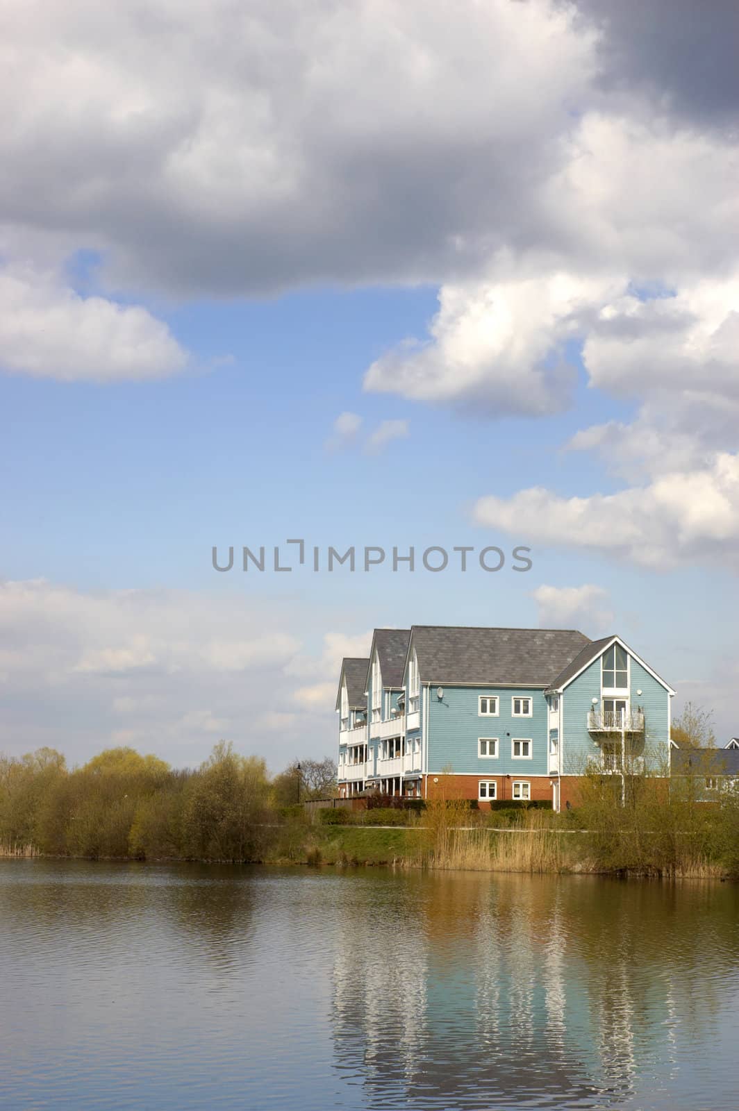 A lake with some wooden clad homes