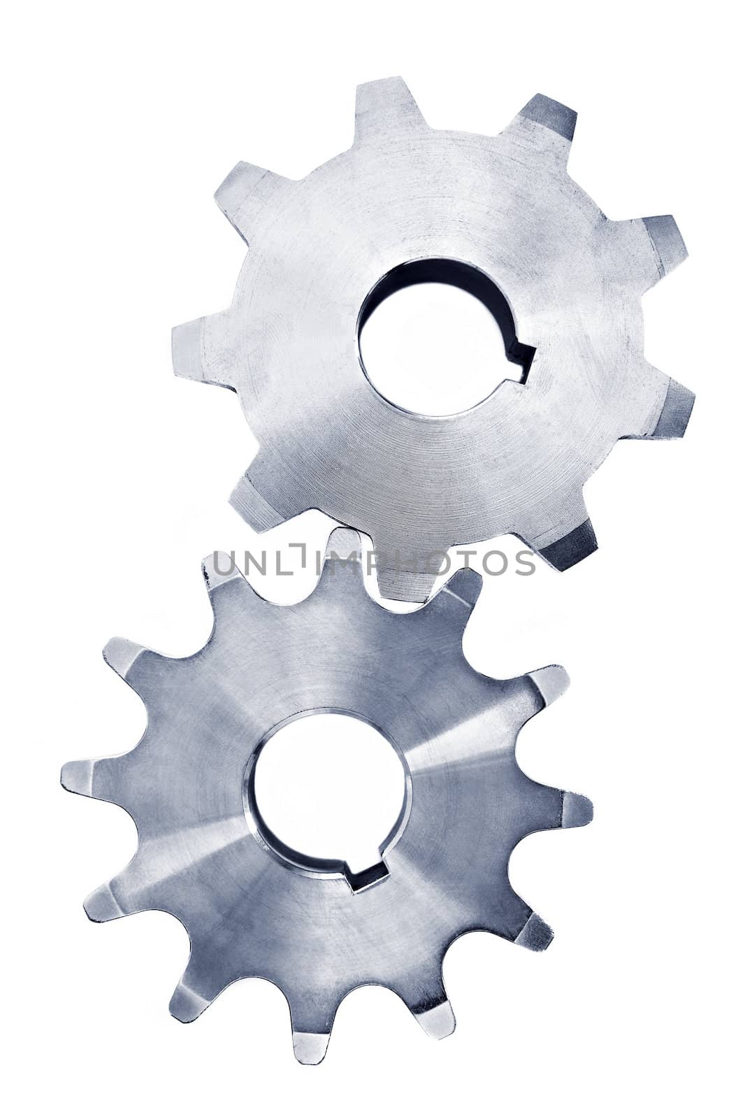 Interlocking industrial metal gears isolated on white
