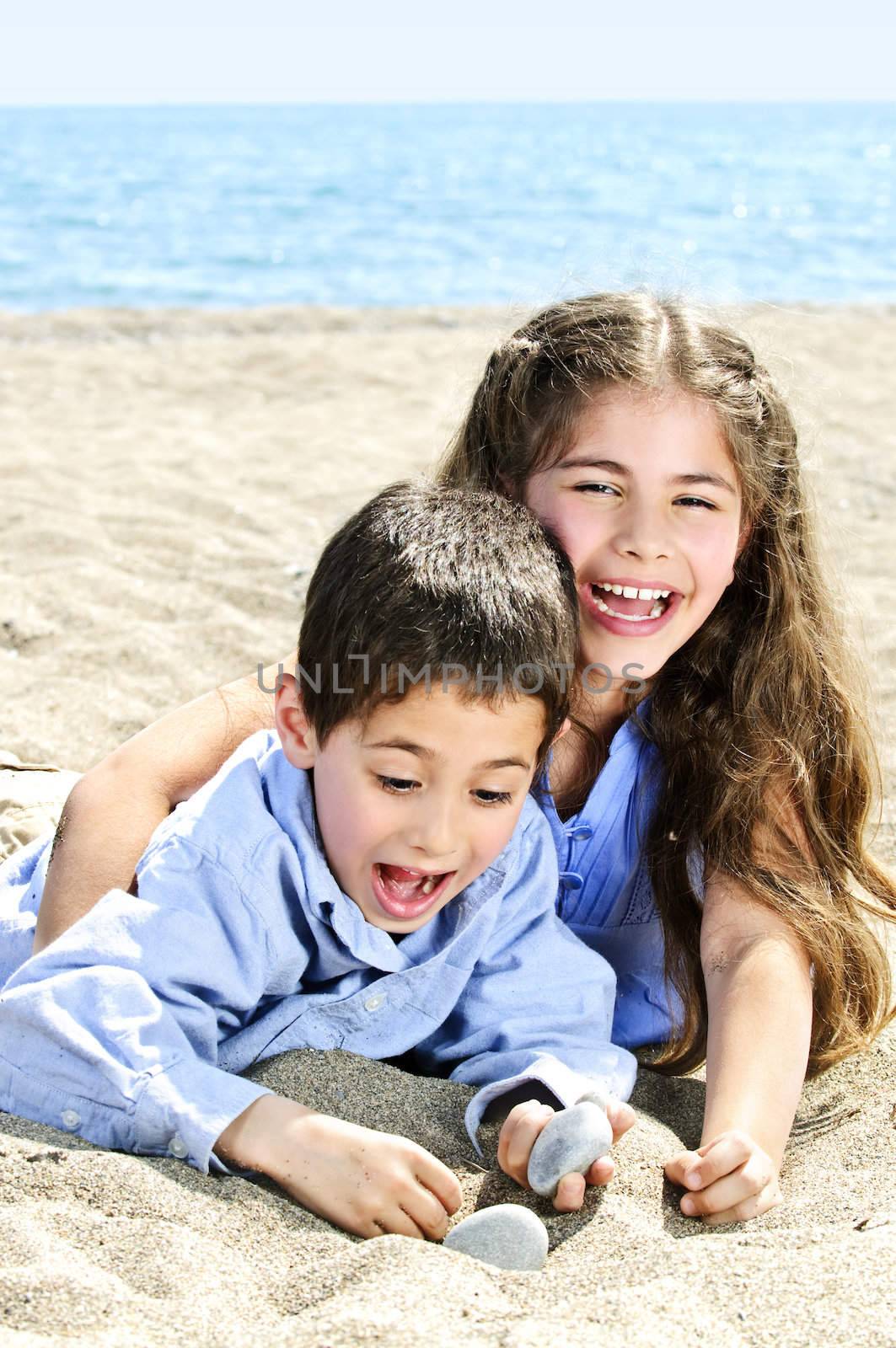 Brother and sister at beach by elenathewise