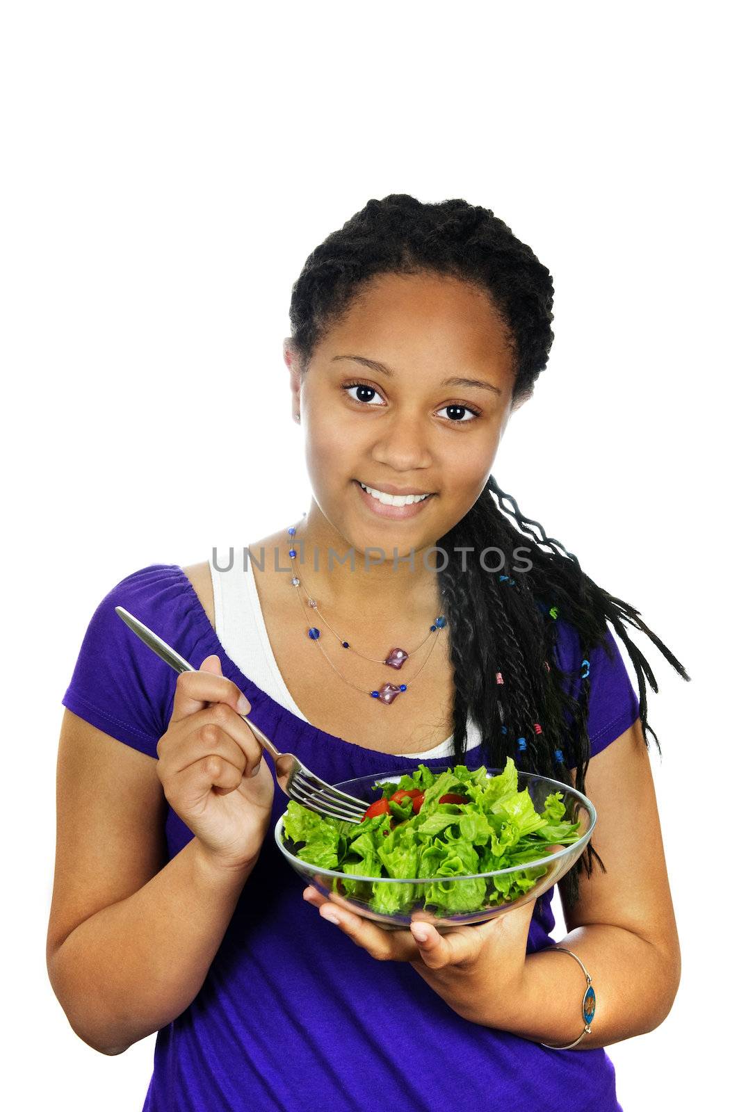 Isolated portrait of black teenage girl with salad bowl