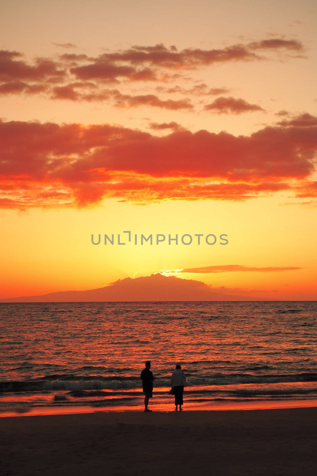 Couple walking at sunset on Wailea Beach east Maui, Hawaii, USA by hotflash2001