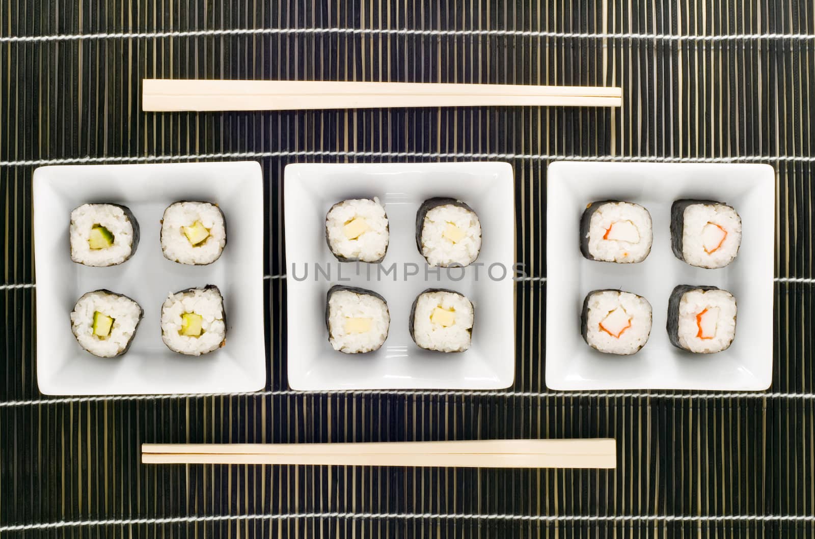 three plates with different kinds of sushi