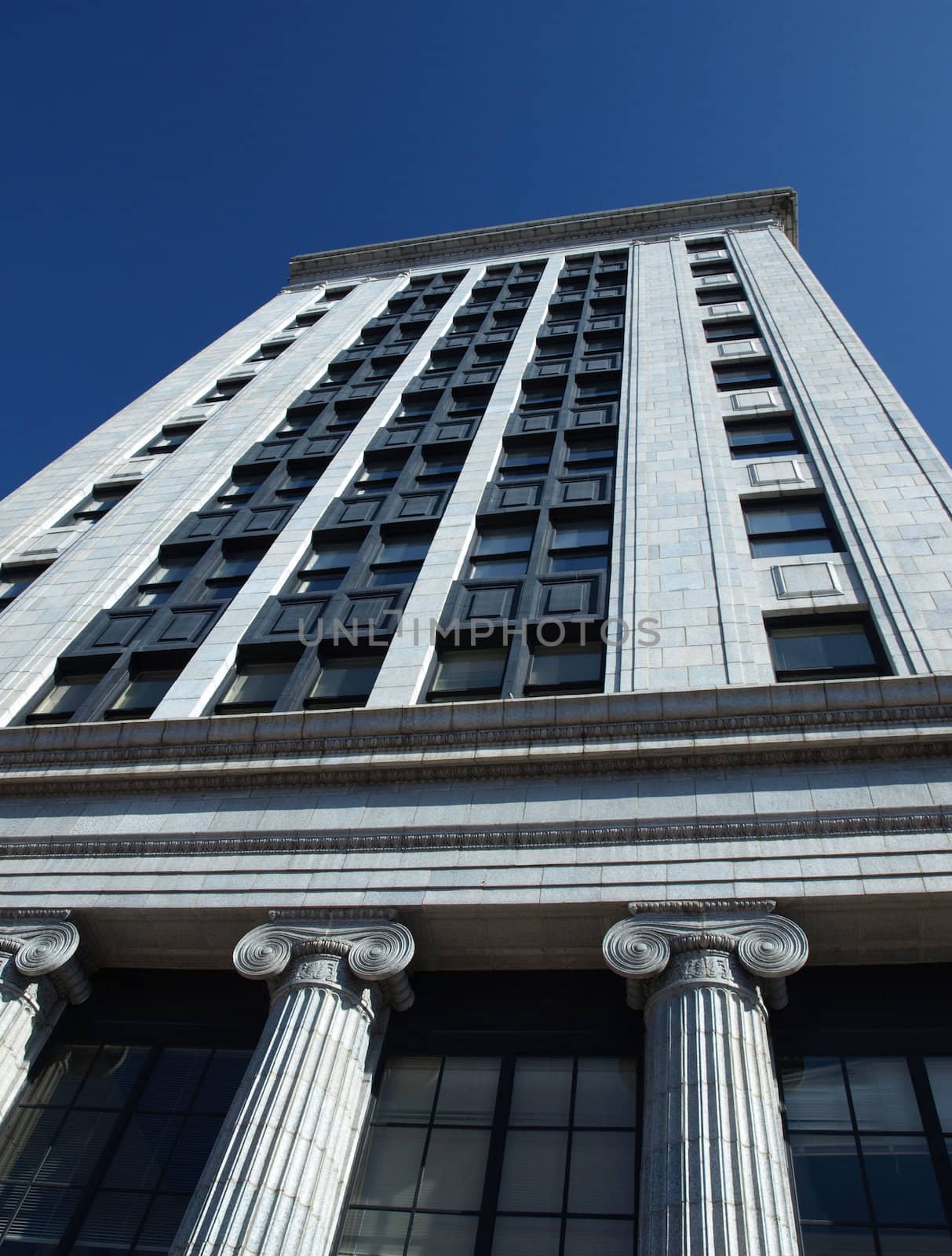 A tall office building in an urban setting