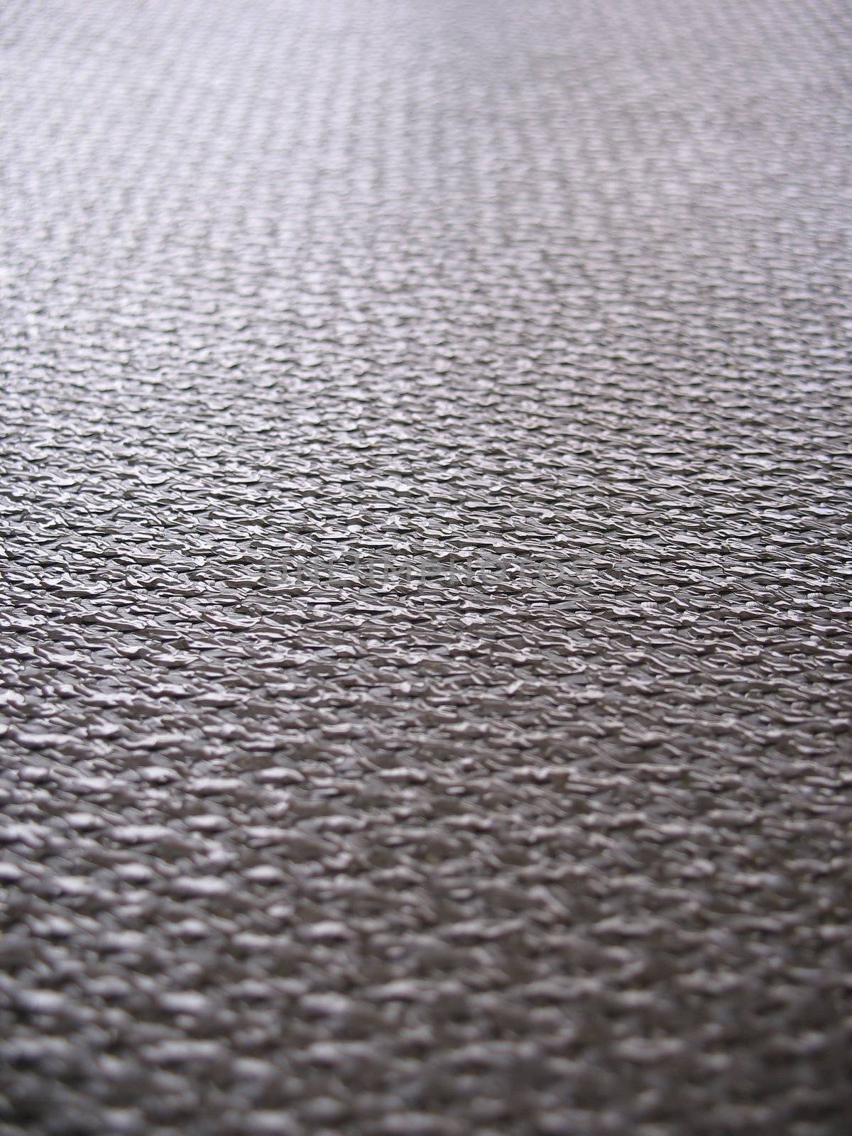 Real carbon fiber in its raw form - this is the material that is used to make durable, strong parts.  Shallow depth of field.