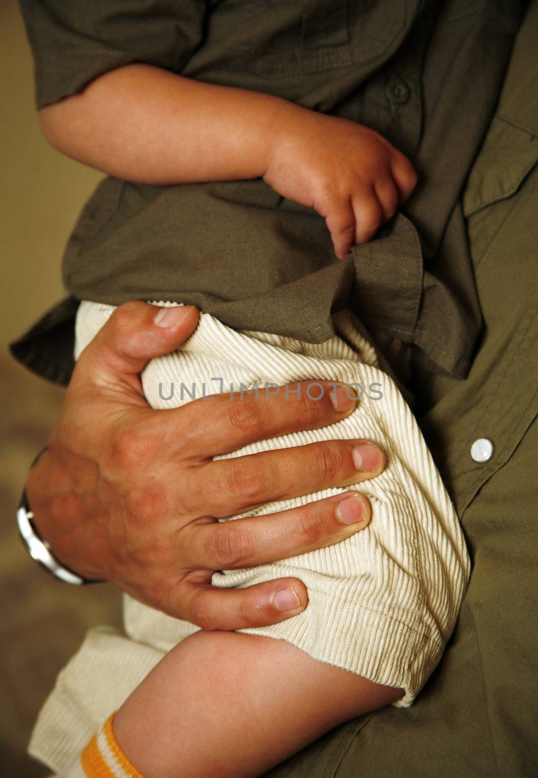 The image of hands of parents and the kid.