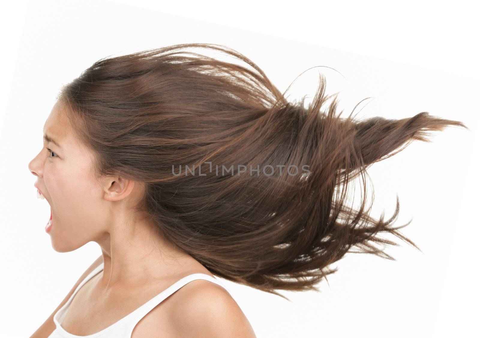 Woman screaming / shouting. Angry and upset beautiful young mixed race asian / caucasian woman in profile. Isolated on white background