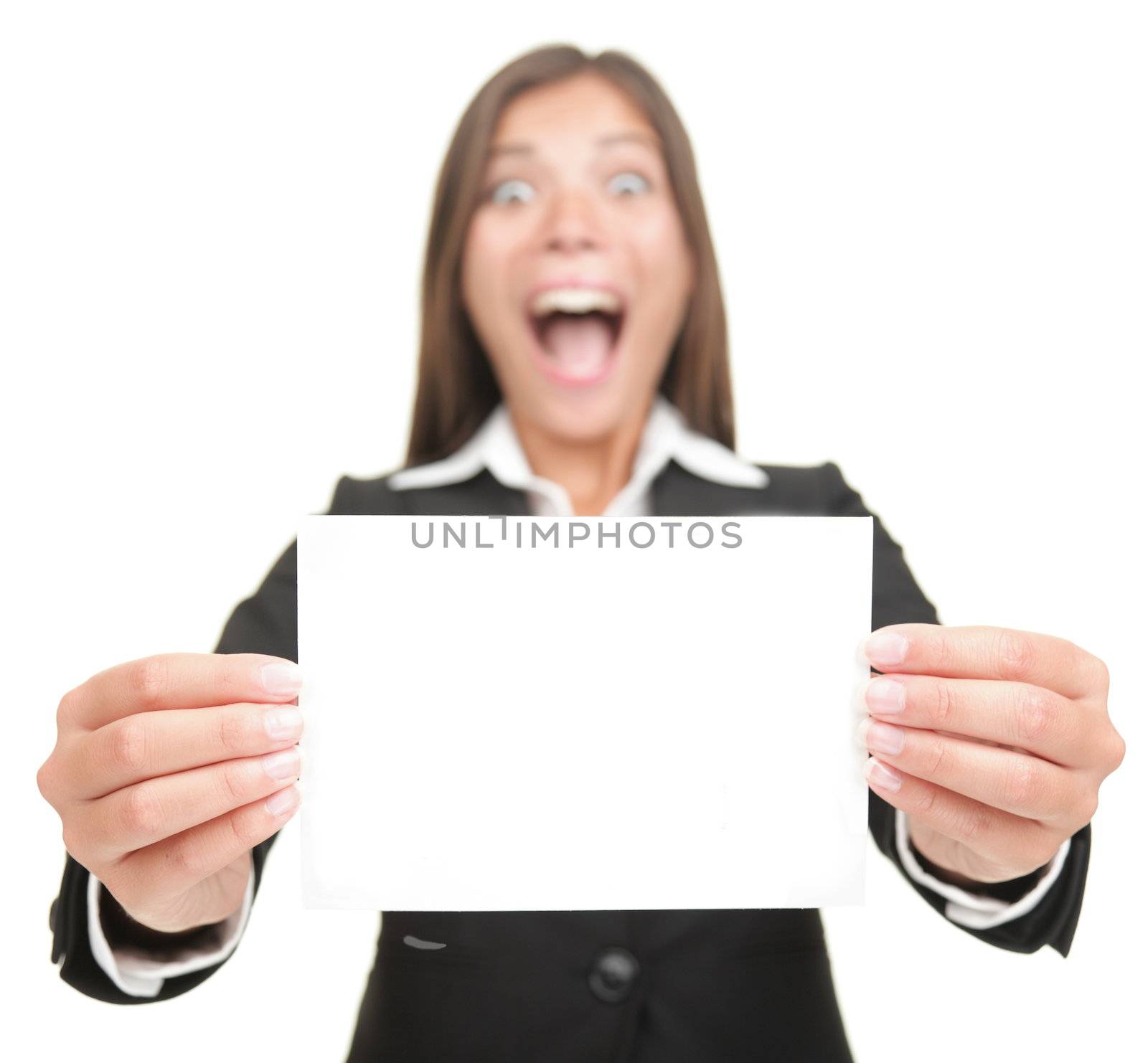 Business woman excited holding empty blank sign. Smiling version also available,  Beautiful mixed Chinese Asian / Caucasian businesswoman. Isolated on seamless white background. 