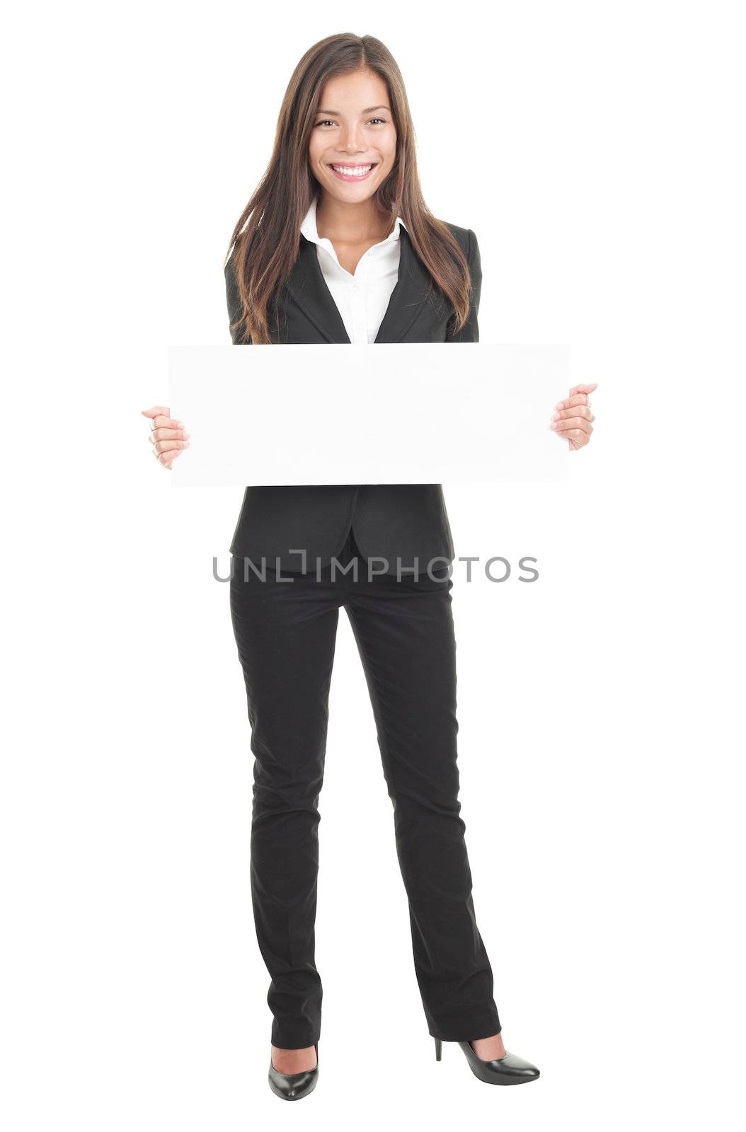 Businesswoman holding a white empty banner or poster in full length. Beautiful mixed race chinese / caucasian woman isolated on white background. 