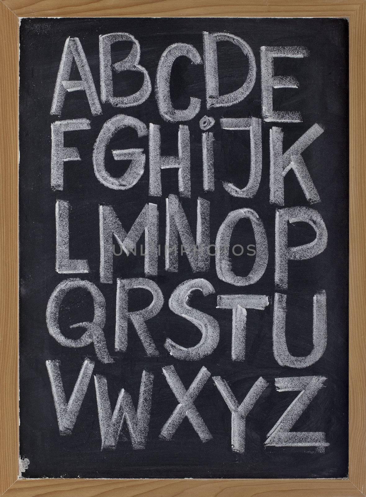 English alphabet on blackboard by PixelsAway