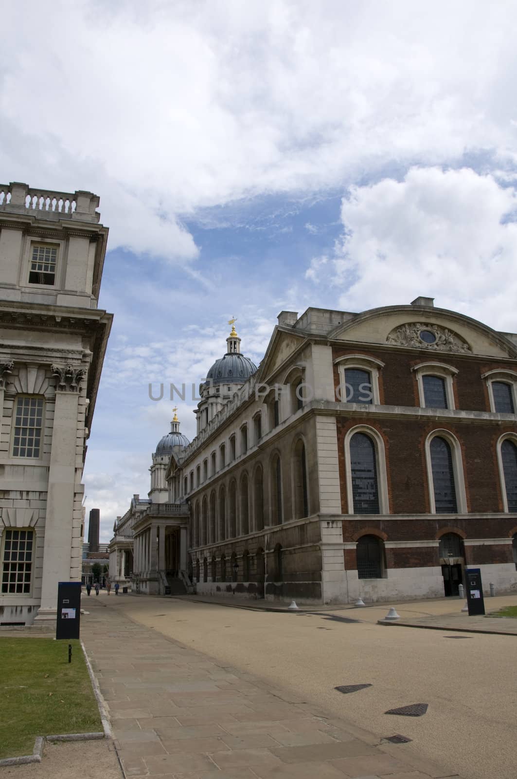 Two georgian buildings in london with a cloudy sky