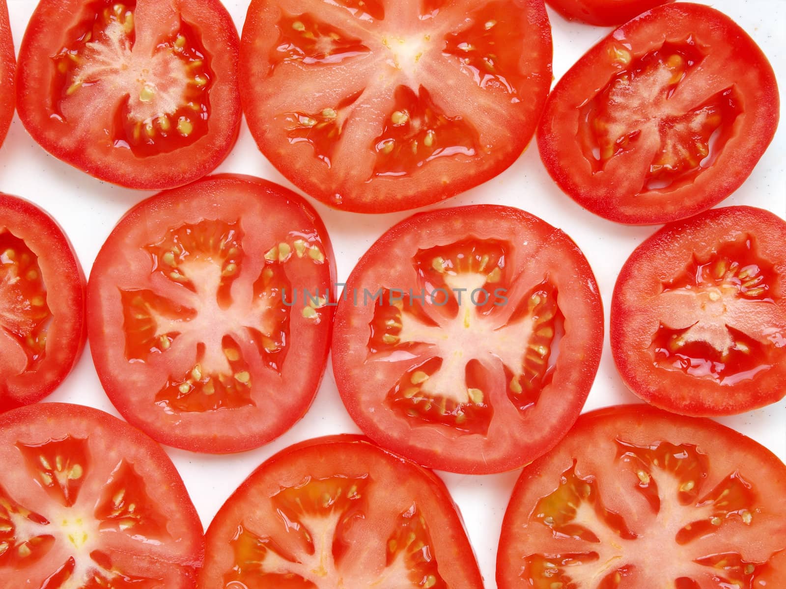 Slice of tomato, isolated on white