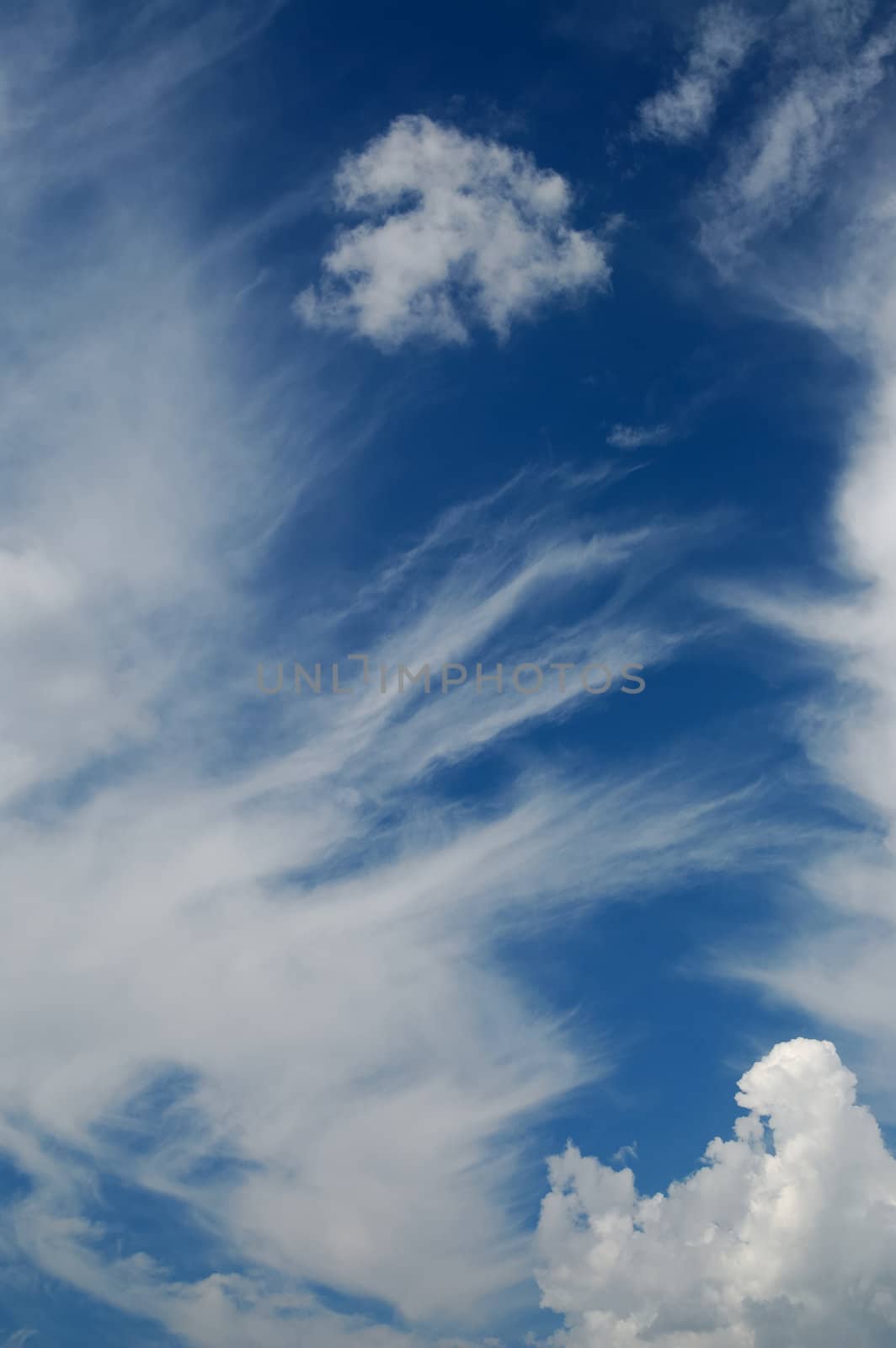 Beautiful fluffy clouds on blue sky