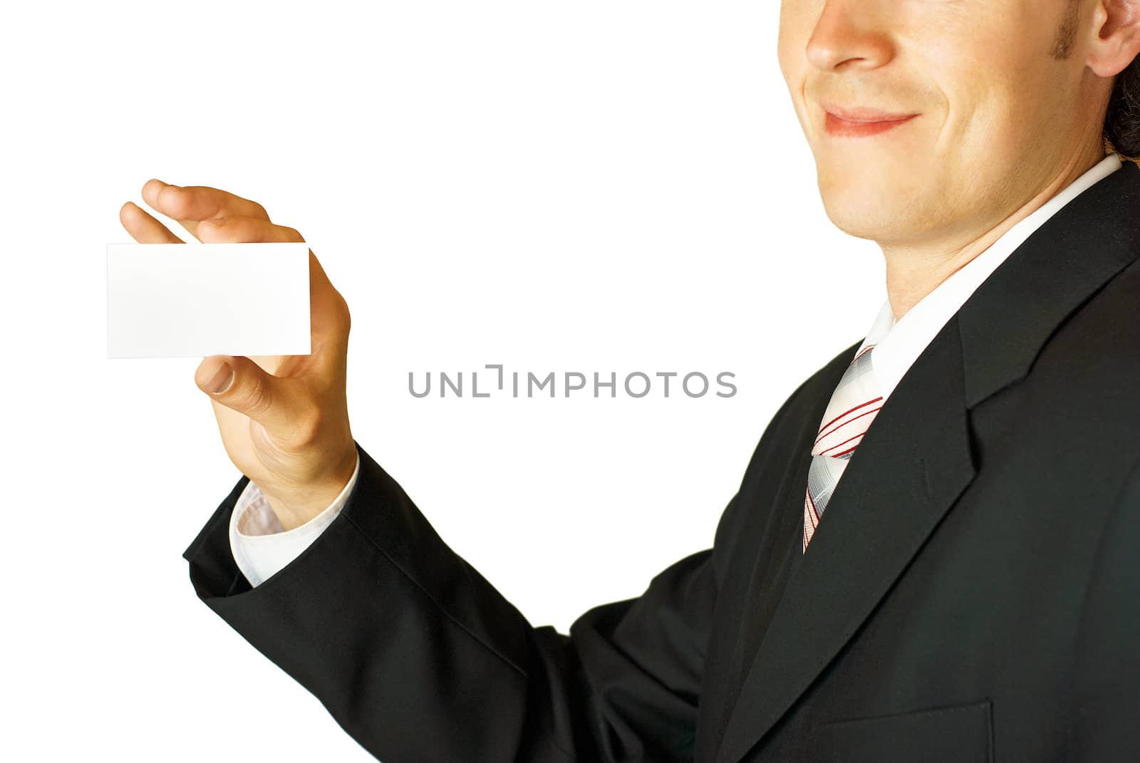 Young businessman holding blank visit card. Backside. Isolated.