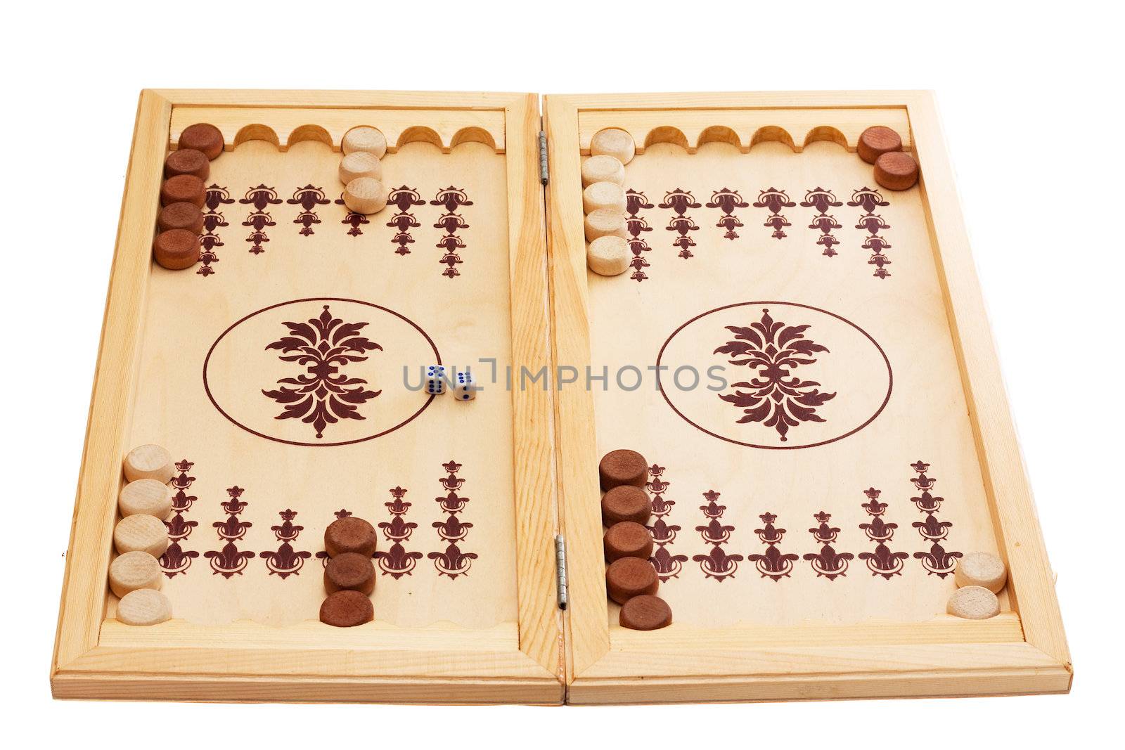 View of dice and game pieces on a backgammon board at the beginning of a game