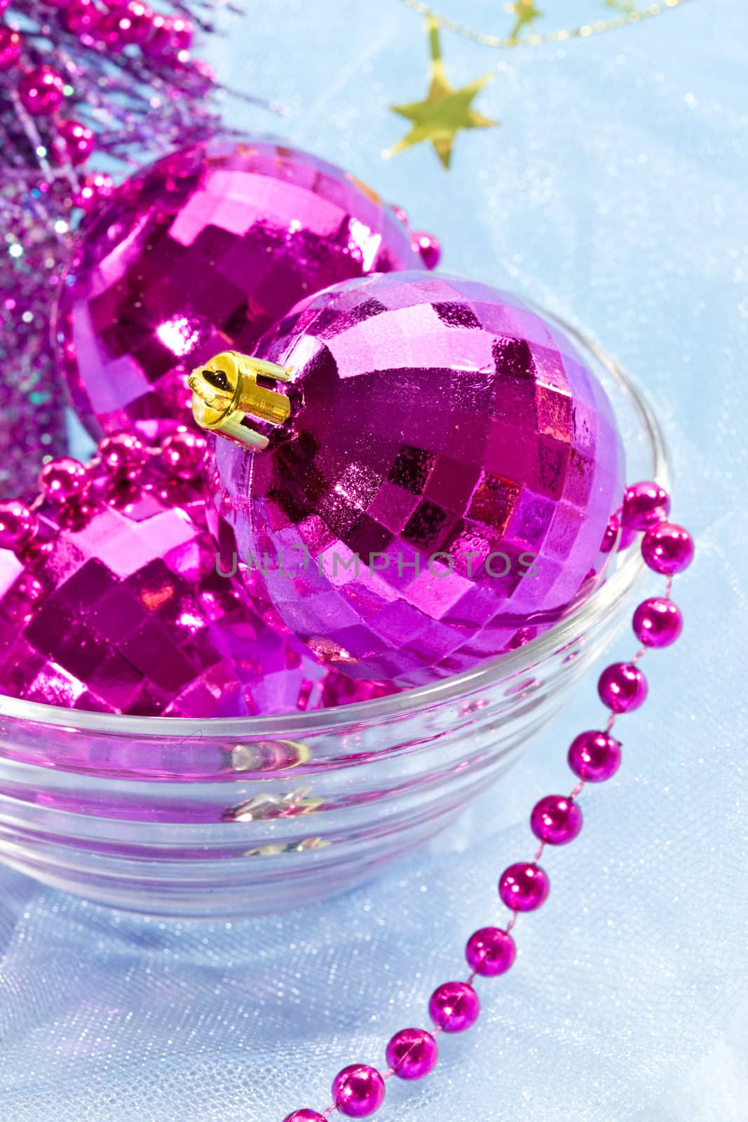 Holiday series: christmas purple ball and garland in bowl