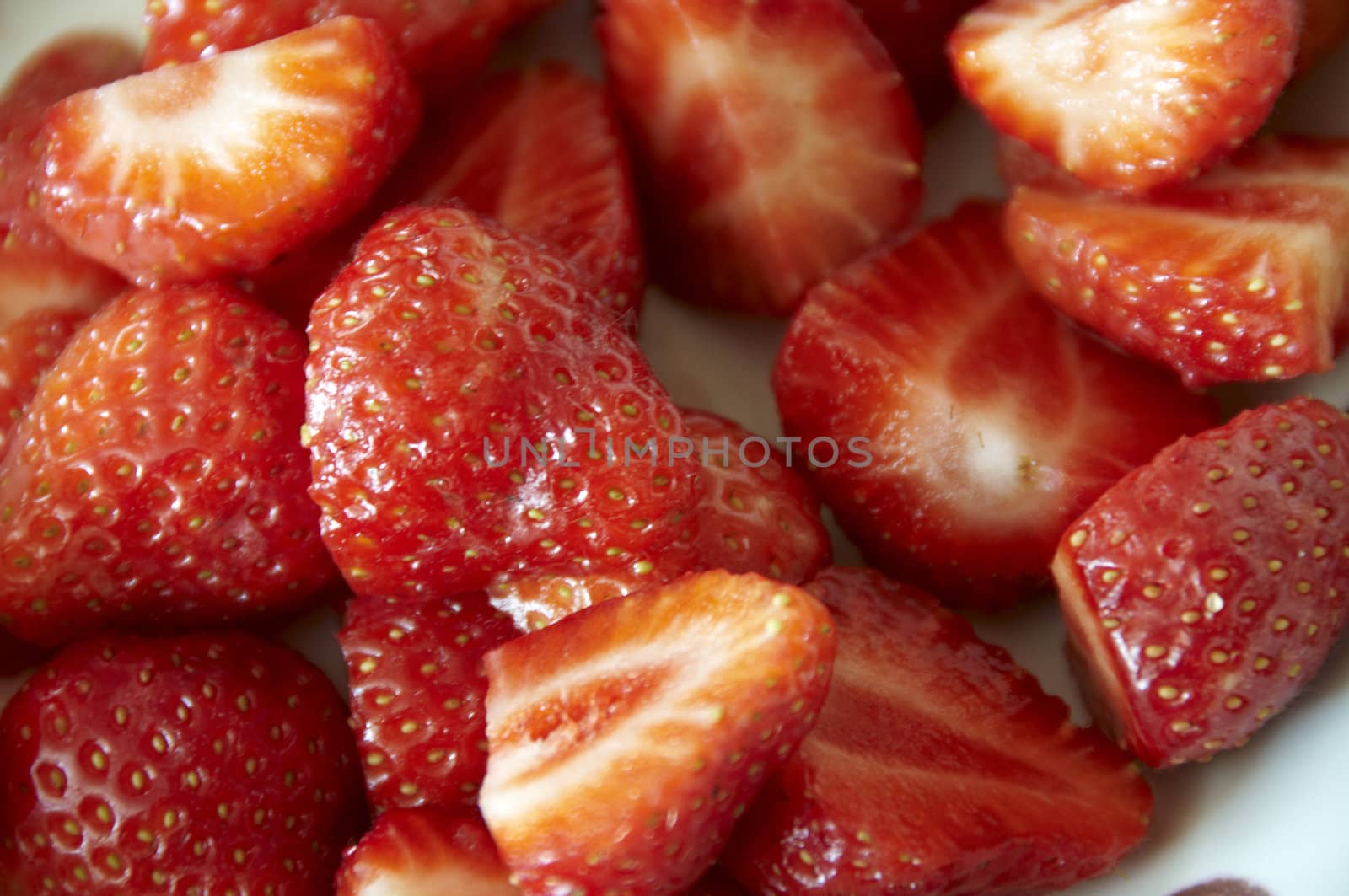 Detail of Cut strawberries  on a dish