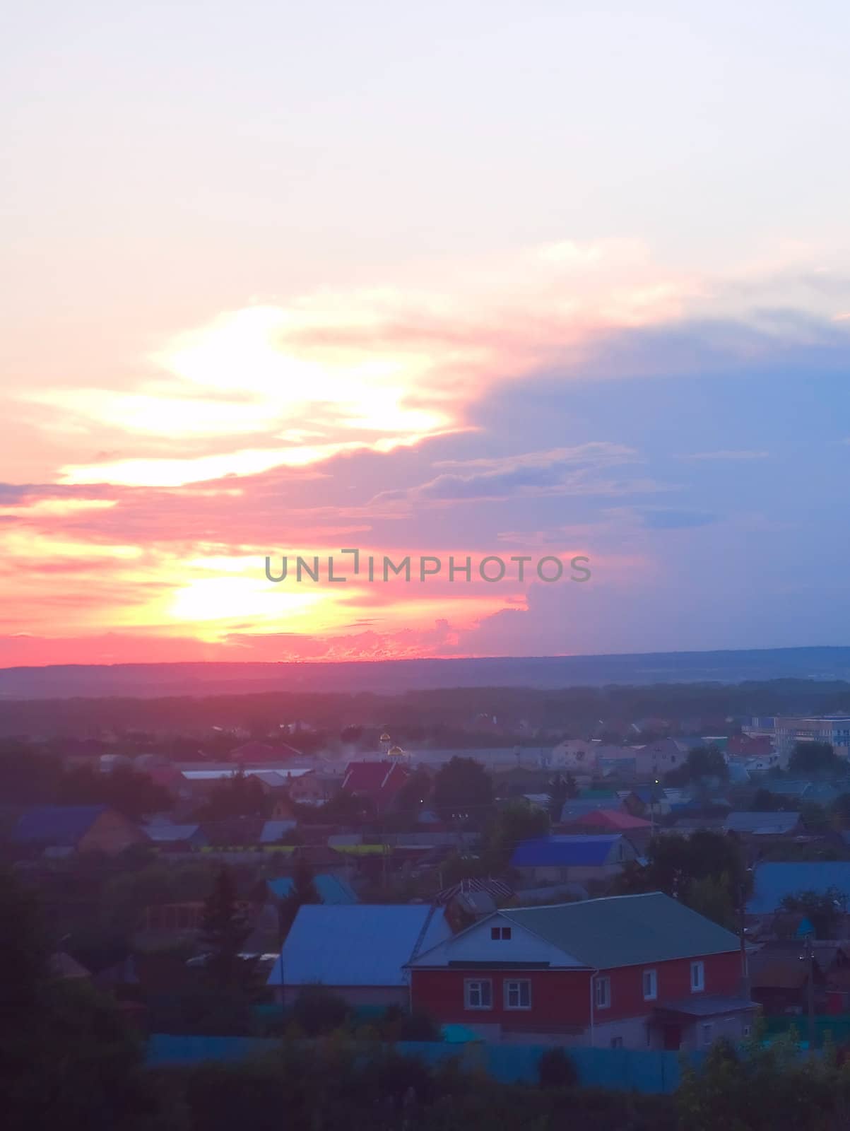 Photo of small village in the evening during a beautiful decline