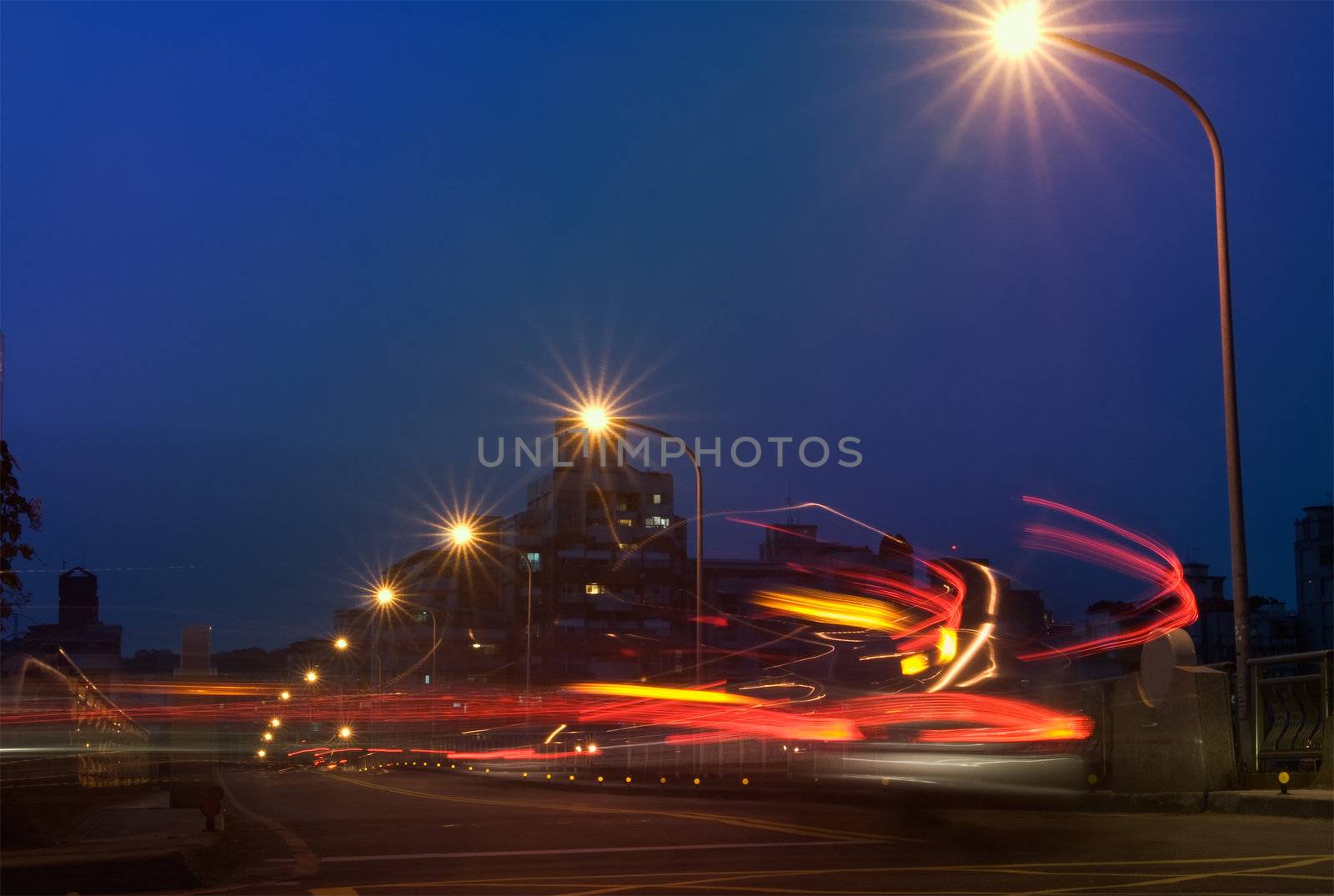 City night scenic of colorful car motion blurred lines and light.