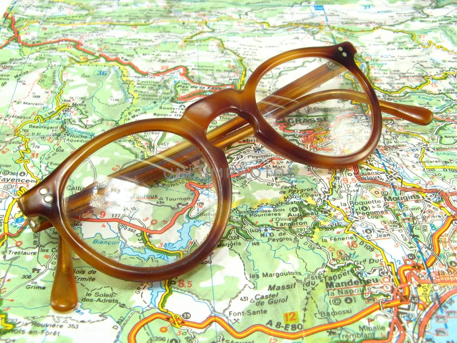 an image of some glasses on a map