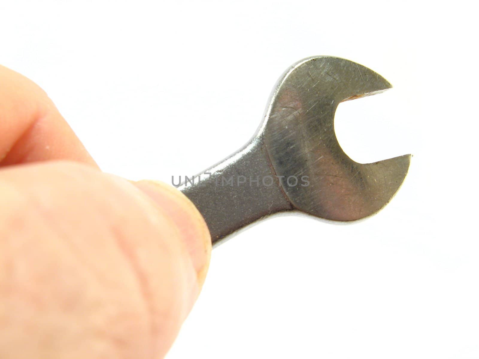 image of hand holding a spanner over a white background