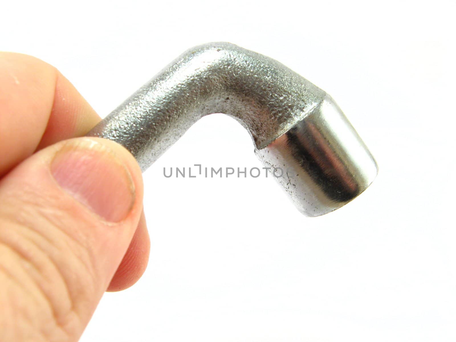 image of hand holding a spanner over a white background