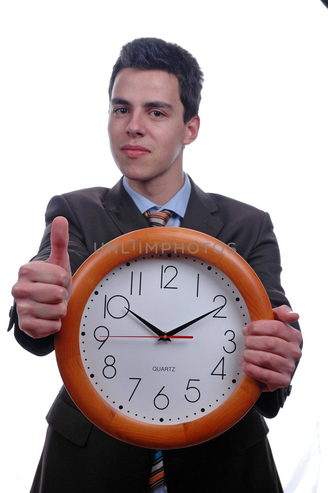 young businessman thumb up and holding wall clock over white background