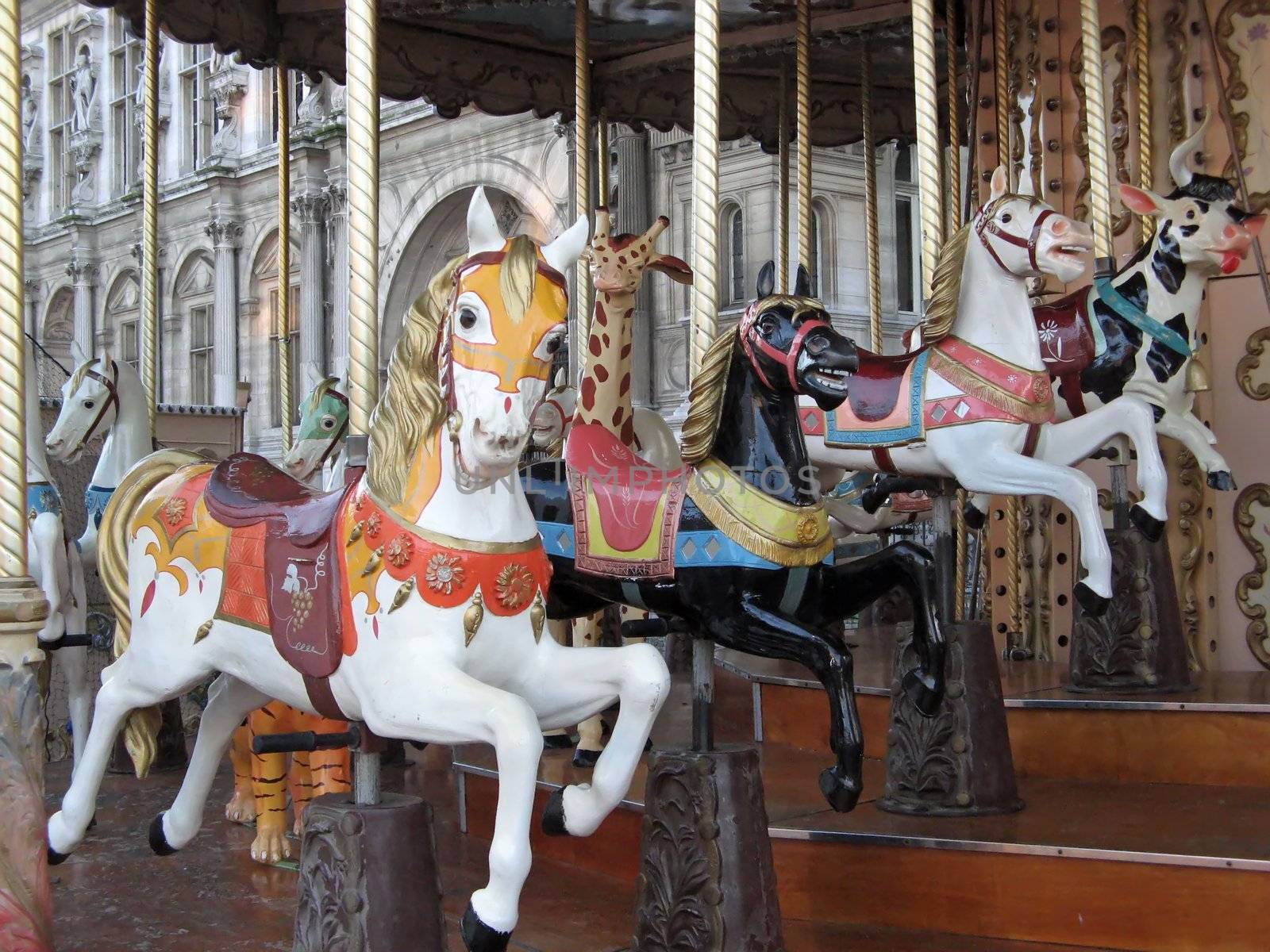 a view of some colored carousel horses